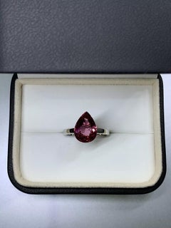 Tourmaline pink pear in 18k white gold engagement ring.