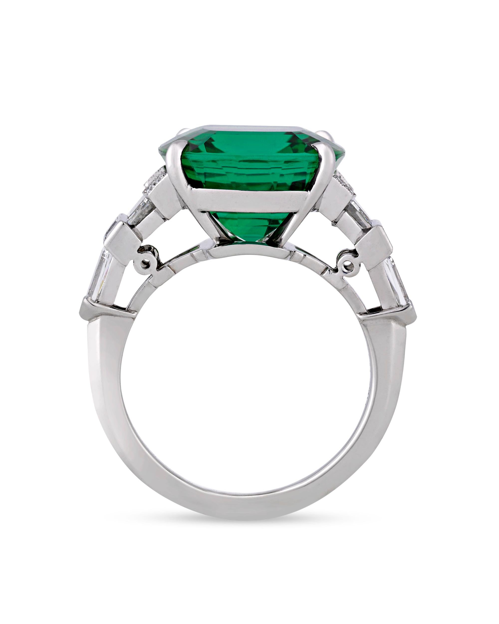 This captivating green tourmaline and diamond ring was crafted by American jeweler and designer Raymond Yard. Absolutely brilliant with an attractive and incredibly vibrant green hue, this stone represents the tourmaline at its very best, with a