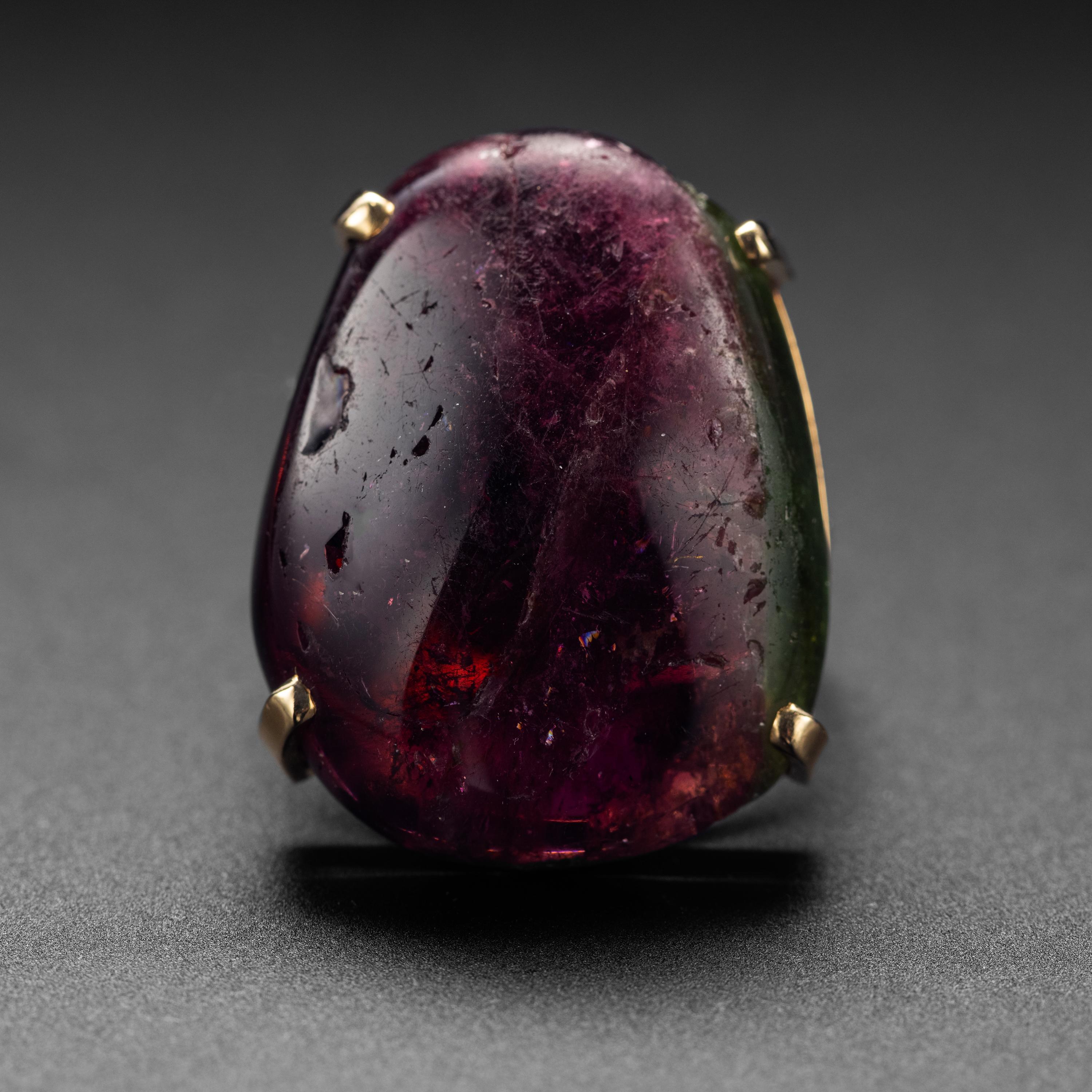 This is the ring your clairvoyant aunt would have left you in her will if only you'd had a clairvoyant aunt with a massive tourmaline ring. Measuring 31.35mm x 24mm and weighing approximately 53.5 carats, this bi-color tourmaline possesses the power