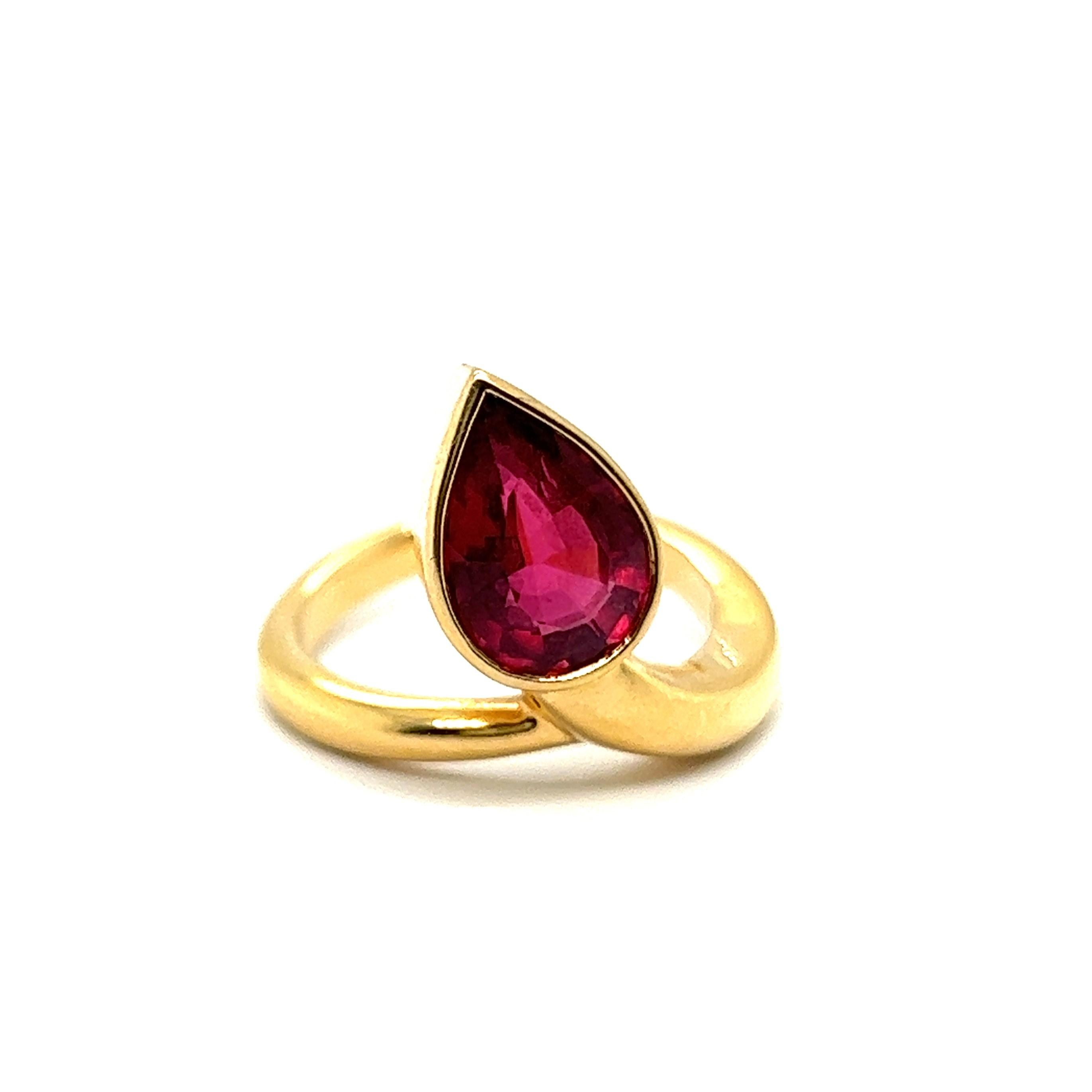 Introducing an elegant tourmaline ring in 18 Karat yellow gold ring, a harmonious blend of sophistication and nature's allure. 

Cradled in the gentle embrace of this ring is a captivating pear-shaped tourmaline, reminiscent of a luscious drop of