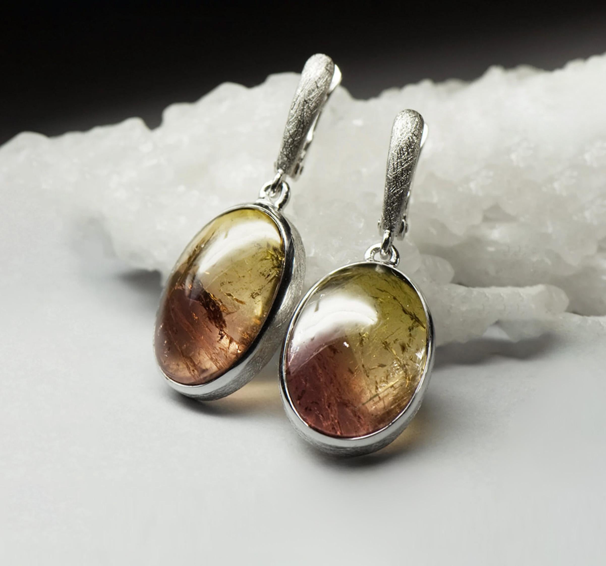 Matte finish silver earrings with natural bicolor Tourmaline 
fine quality cabochon cut  gemstone
stone measurements - 0.2 x 0.55 x 0.79 in / 5 х 14 х 20 mm
stones weight - 30 carats
earrings length - 1.46 in / 37 mm
earrings weight - 10.49