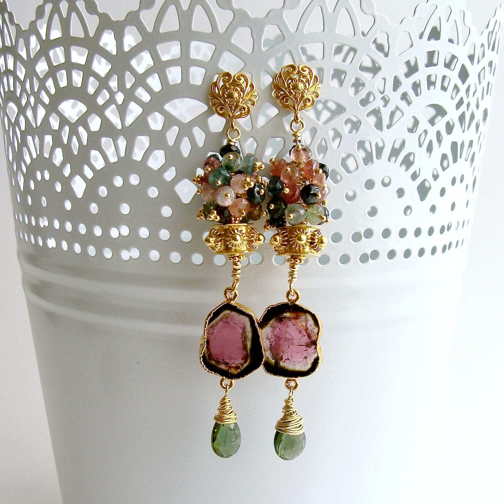 A generous cluster of multi-colored tourmaline rondelles crowns a hexagonal gold vermeil cannetille bead, while coveted watermelon tourmaline slices  and green tourmaline wrapped briolettes dangle sweetly below.  The design is suspended from