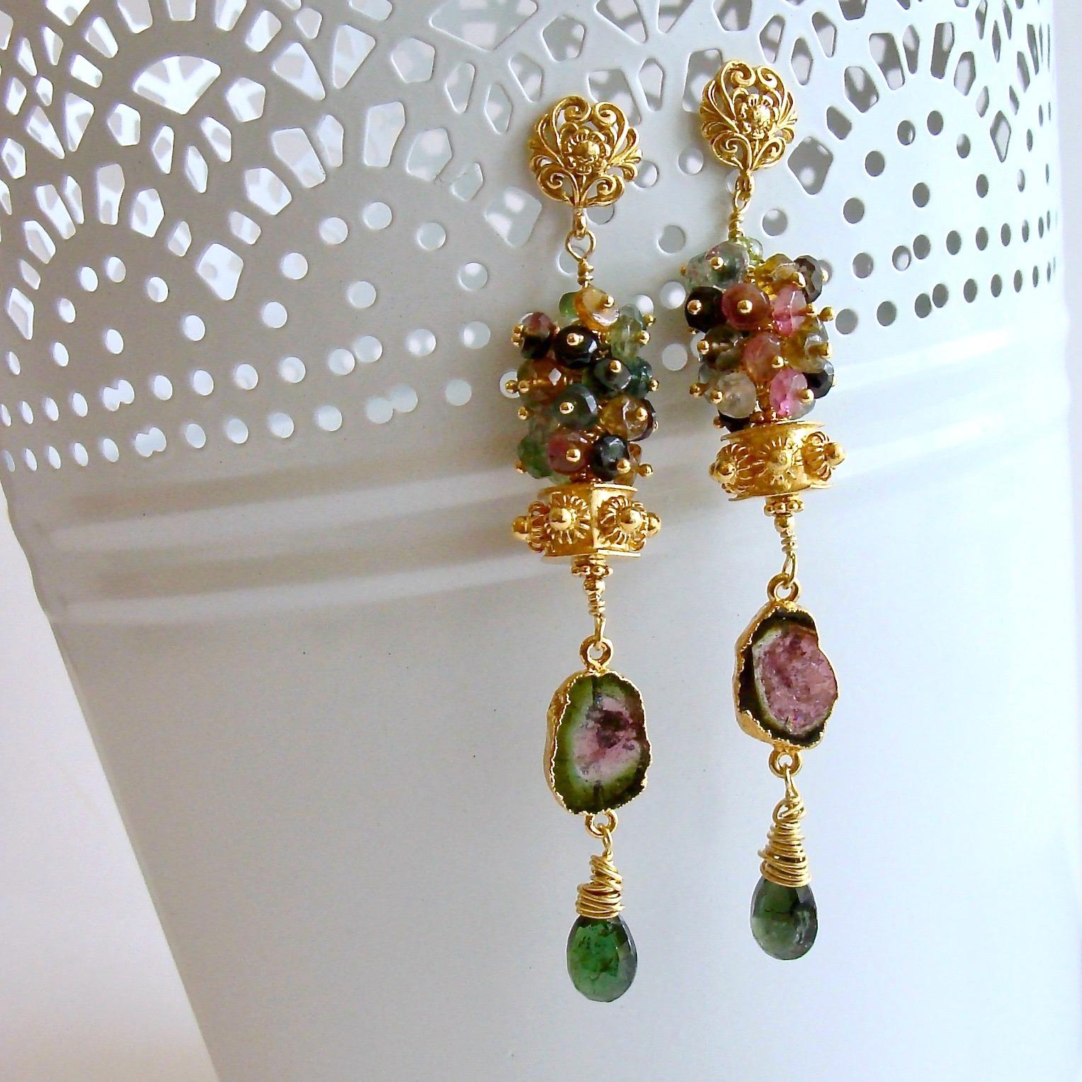 A generous cluster of multi-colored tourmaline rondelles crowns a hexagonal gold vermeil cannetille bead, while coveted watermelon tourmaline slices  and green tourmaline wrapped briolettes dangle sweetly below.  The design is suspended from
