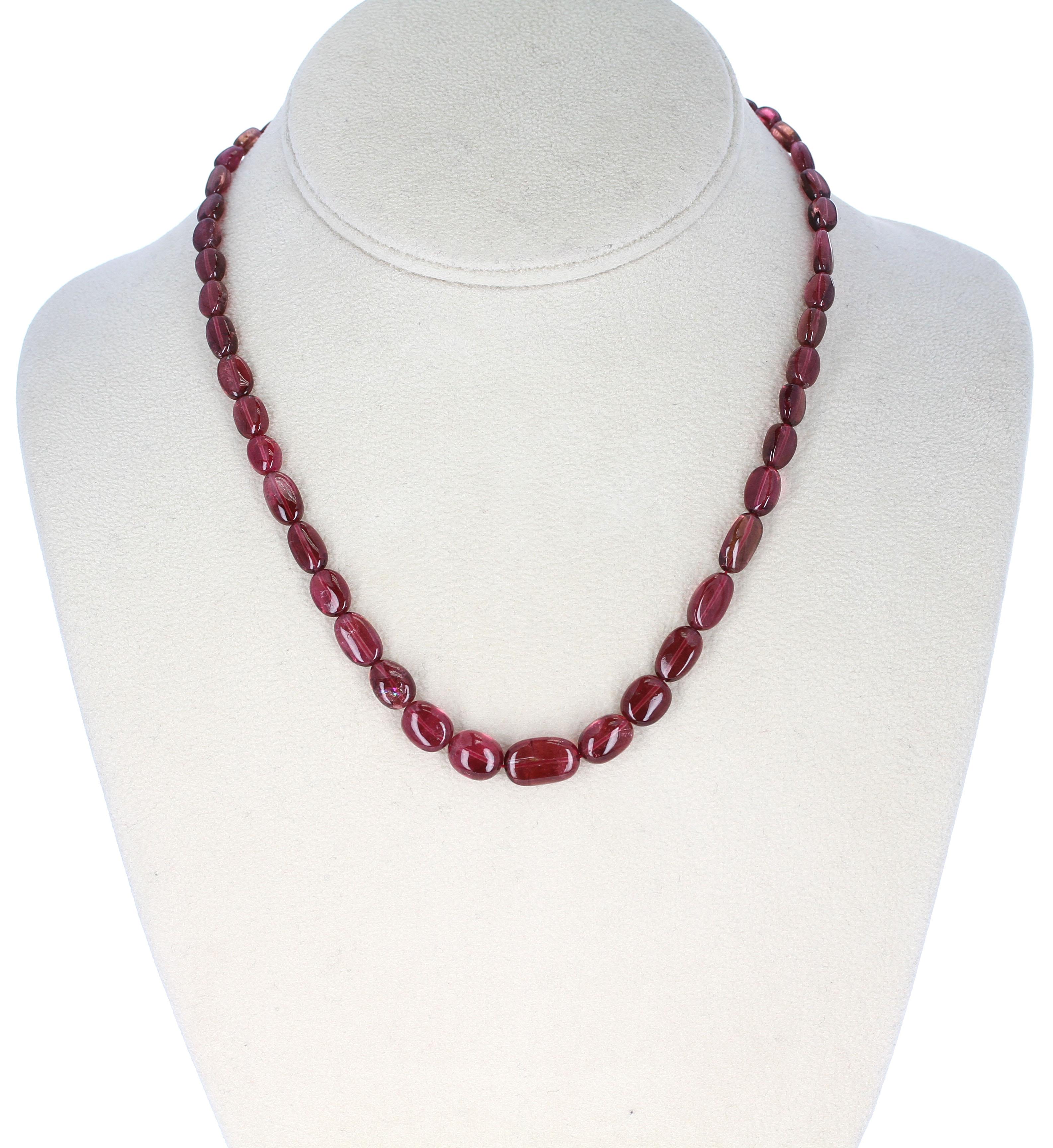 A strand of Tourmaline Smooth Tumbled Beads with a Sterling Silver Toggle Clasp. Length: 17.25