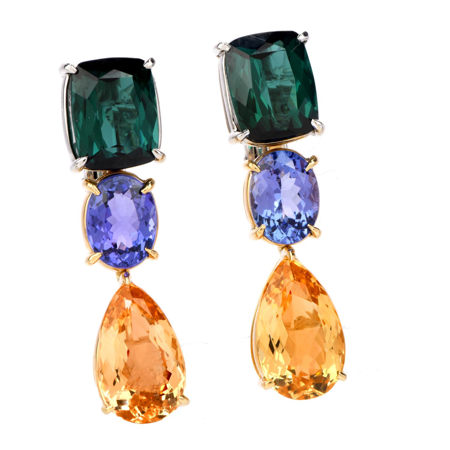 WD-PRG-02
Loose yourself in these inviting Estate Tourmaline Tanzanite & Imperial Topaz 18K Gold Drop Dangle Earrings.  These

welcoming and warm earrings are crafted in 18 karat white and yellow gold.  The top portion has two deep green genuine