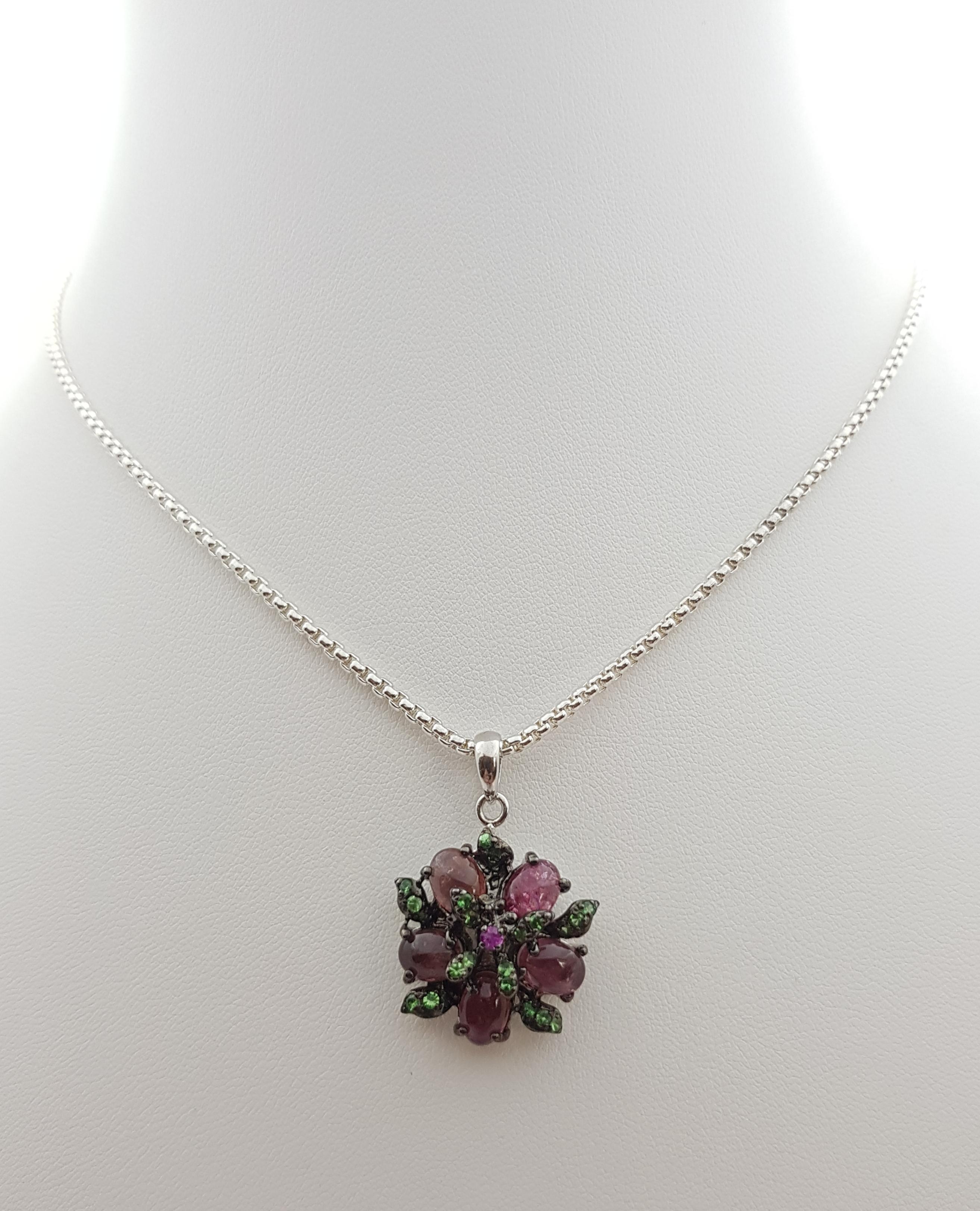 Tourmaline, Tsavorite and Pink Sapphire Pendant set in Silver Settings
(chain not included)

Width: 2.2 cm 
Length: 3.1 cm
Total Weight: 4.84  grams

*Please note that the silver setting is plated with rhodium to promote shine and help prevent