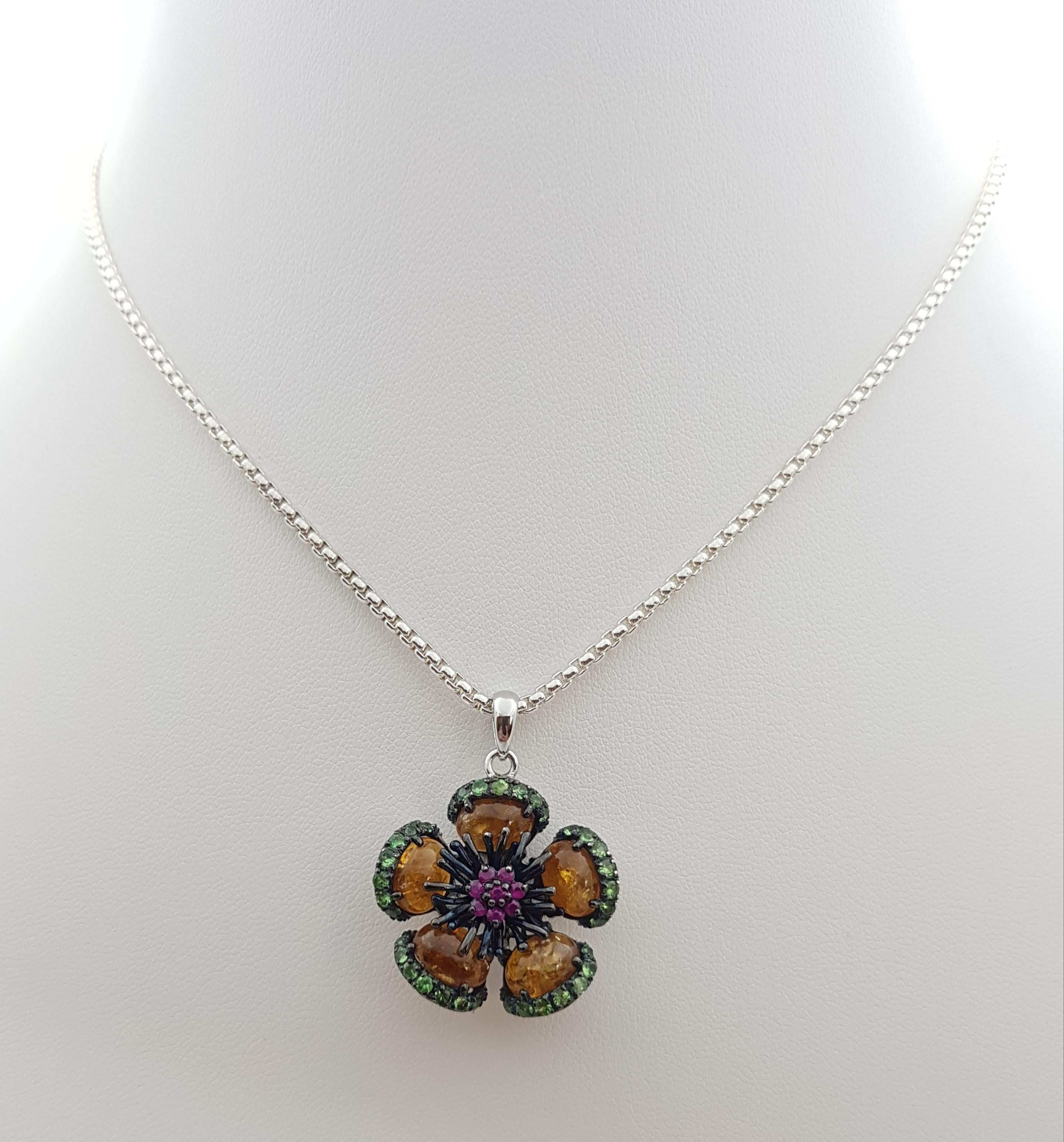 Tourmaline, Tsavorite and Ruby Pendant set in Silver Settings
(chain not included)

Width: 2.5 cm 
Length: 3.2 cm
Total Weight: 6.77  grams

*Please note that the silver setting is plated with rhodium to promote shine and help prevent oxidation. 