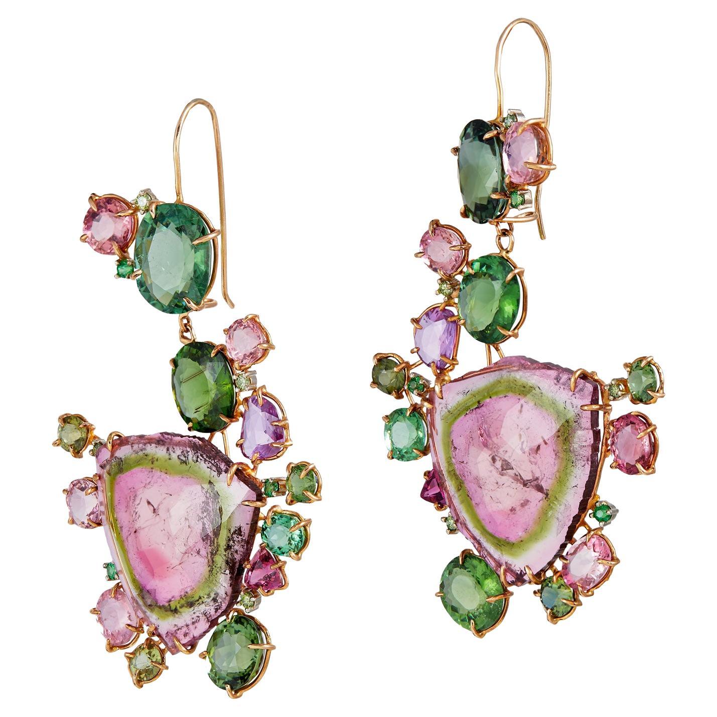 Hand Made Tourmaline slice earrings in 18k rose gold with rose cut sliced watermelon tourmaline centers.  Each earring was specially fashioned by hand with custom settings and french hook backs. Total watermelon tourmaline weight approx. 95.68 CTS ,