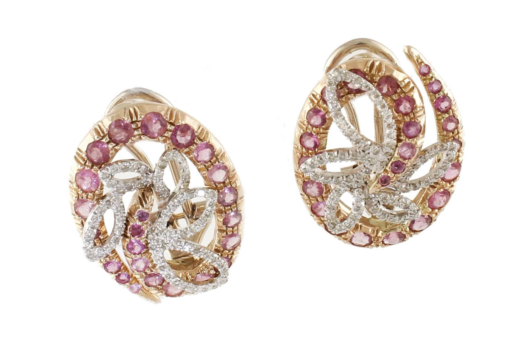 Fascinating earrings, 14 kt rose gold, with a vortex-shaped design embellished with 0.48 ct diamond petals, and fantastic pink ct 2.85 tourmalines. Total weight g 11.10.
Diamonds ct 0.48
Tourmaline ct 2.85
Total weight g 11.10
R.F  +HFHO
RK.