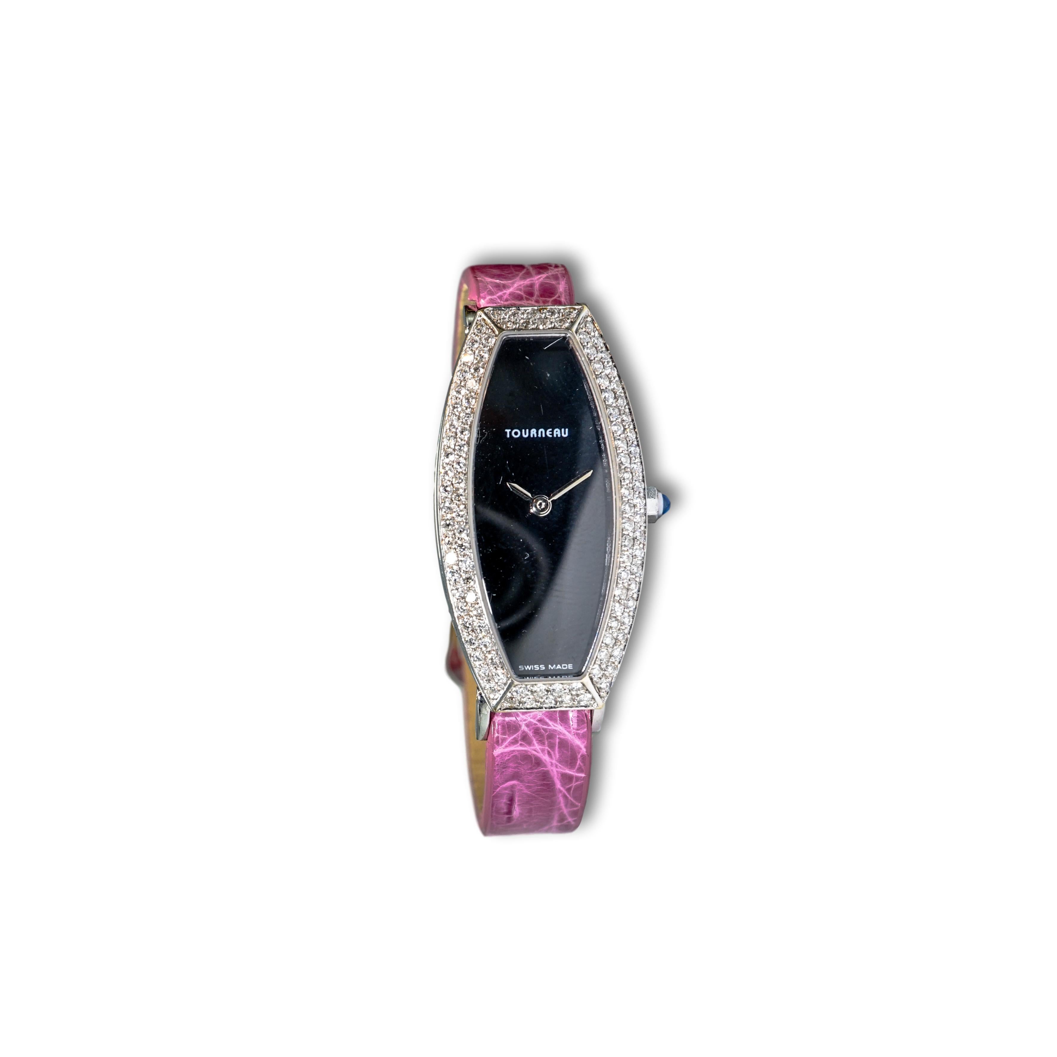 This modern Tourneru watch is 18K White Gold, it sports surrounding Diamonds and a Mother Of Pearl watch face, it is thought to be created in the late 1980s. 

SKU#W-00784