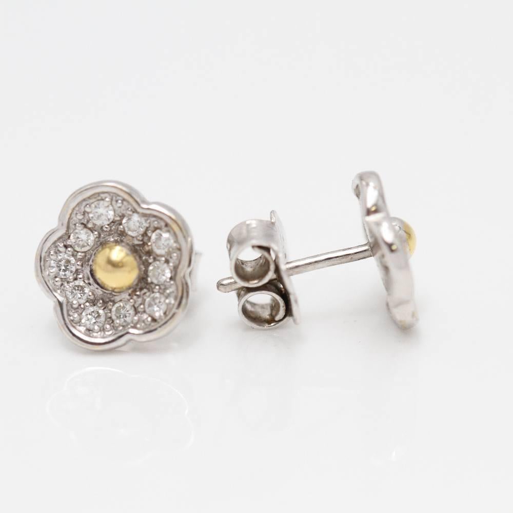 TOUS gold flower earrings : Diamonds : Snap clasp : 18 kt. bicolour gold : 3.2 grams. Measurements: 10.4 mm long and 10.1 mm wide. These earrings are in excellent condition, without any visible wear and tear. Ref: E363471B.