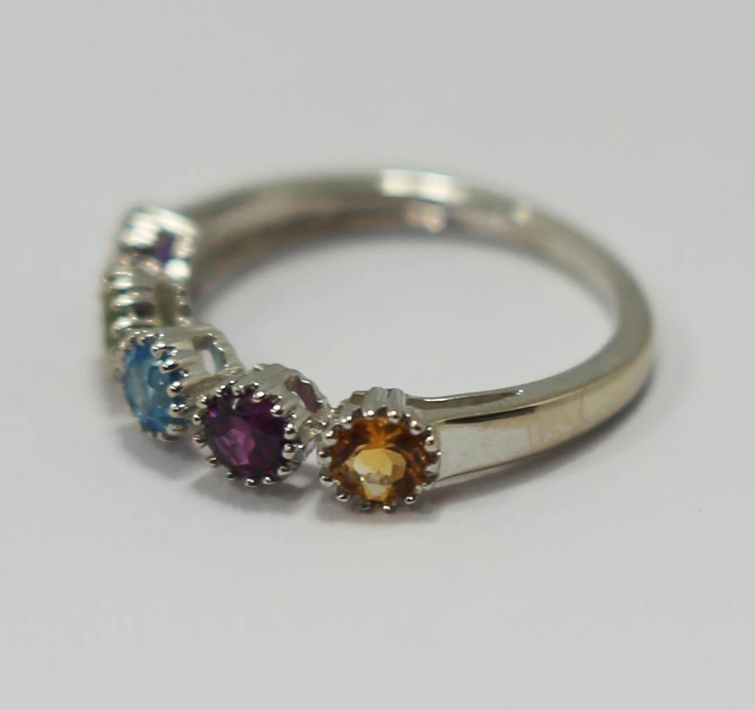 Fancy 5 coloured gems, amethyst, topaz, citirine and olivine peridot of 0.20ct in 18kt white gold 
Ring weight 3.4gr of 18k gold 
Ring size Europe 53, US 6 3/4
Three generations and over 100 years of dedication to the craft demonstrate the wisdom of
