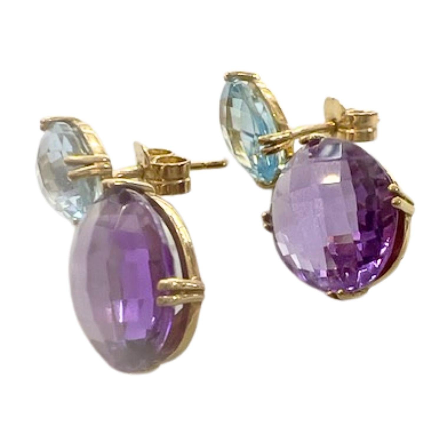 Elegant earrings by TOUS, featuring a modern design with amethyst and aquamarine gemstones, perfect for adding a touch of color and sophistication to any look.

**IN STOCK**

Technical Specifications:

Material: 18k Gold
Weight: 5.40 grams
Amethyst: