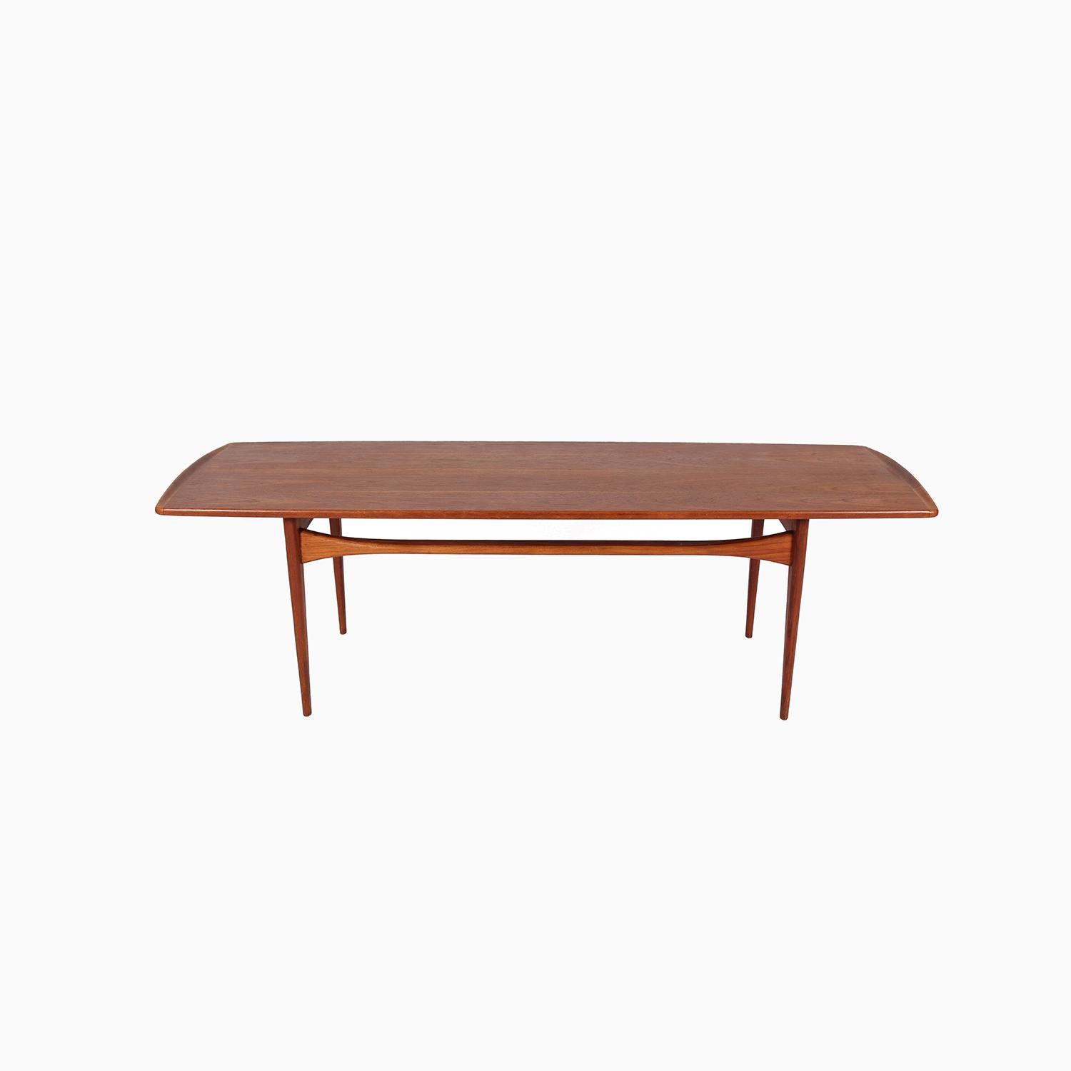 A well made and attractive coffee table designed by Tove & Edvard Lindt-Larsen. Beautifully sculpted undulating stretchers and sculpted solid teak ends. Manufactured by France & Daverkosen.

Professional, skilled furniture restoration is an