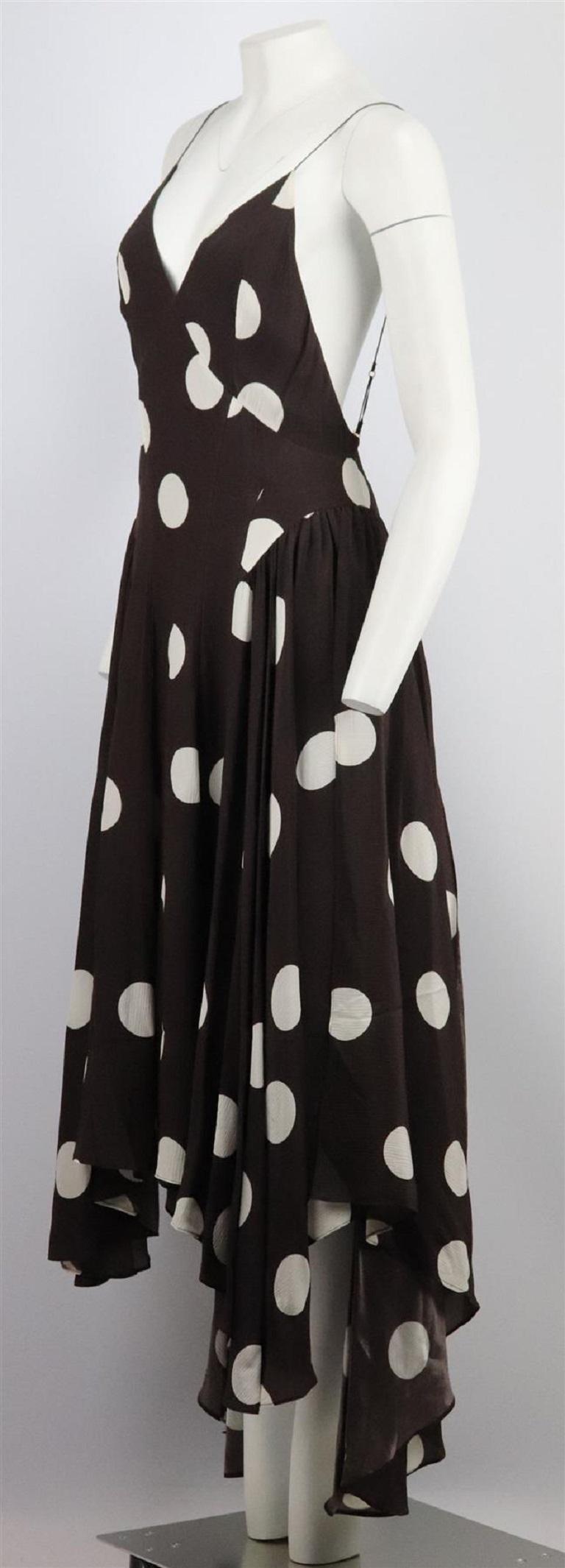 This ‘Maren’ midi dress by TOVE is made from brown and white polka-dot silk-crepon, it has seamed cups and a panelled waist that draws the eye in before falling to a flouncy, handkerchief hem. Brown and white silk. Concealed hook and zip fastening