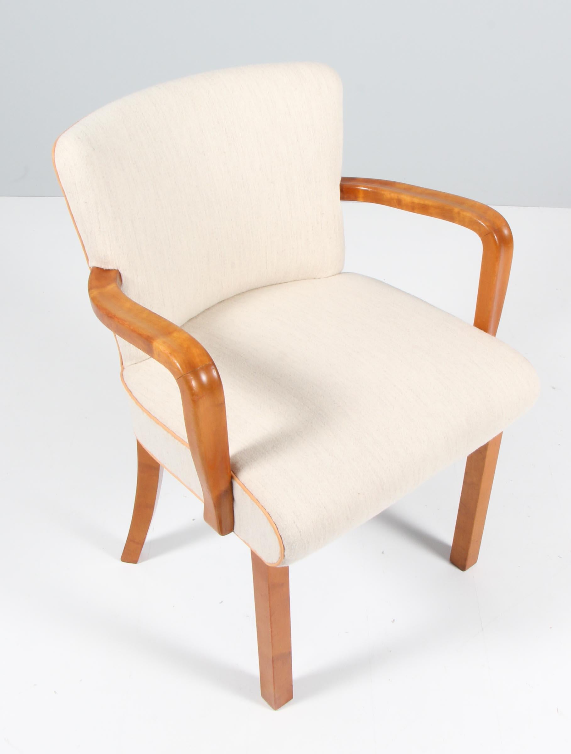 Tove Reddersen armchair made of fruittree, upholstered with white savak wool fabric, nature leather tubings.

Made in Denmark in the 1930s.