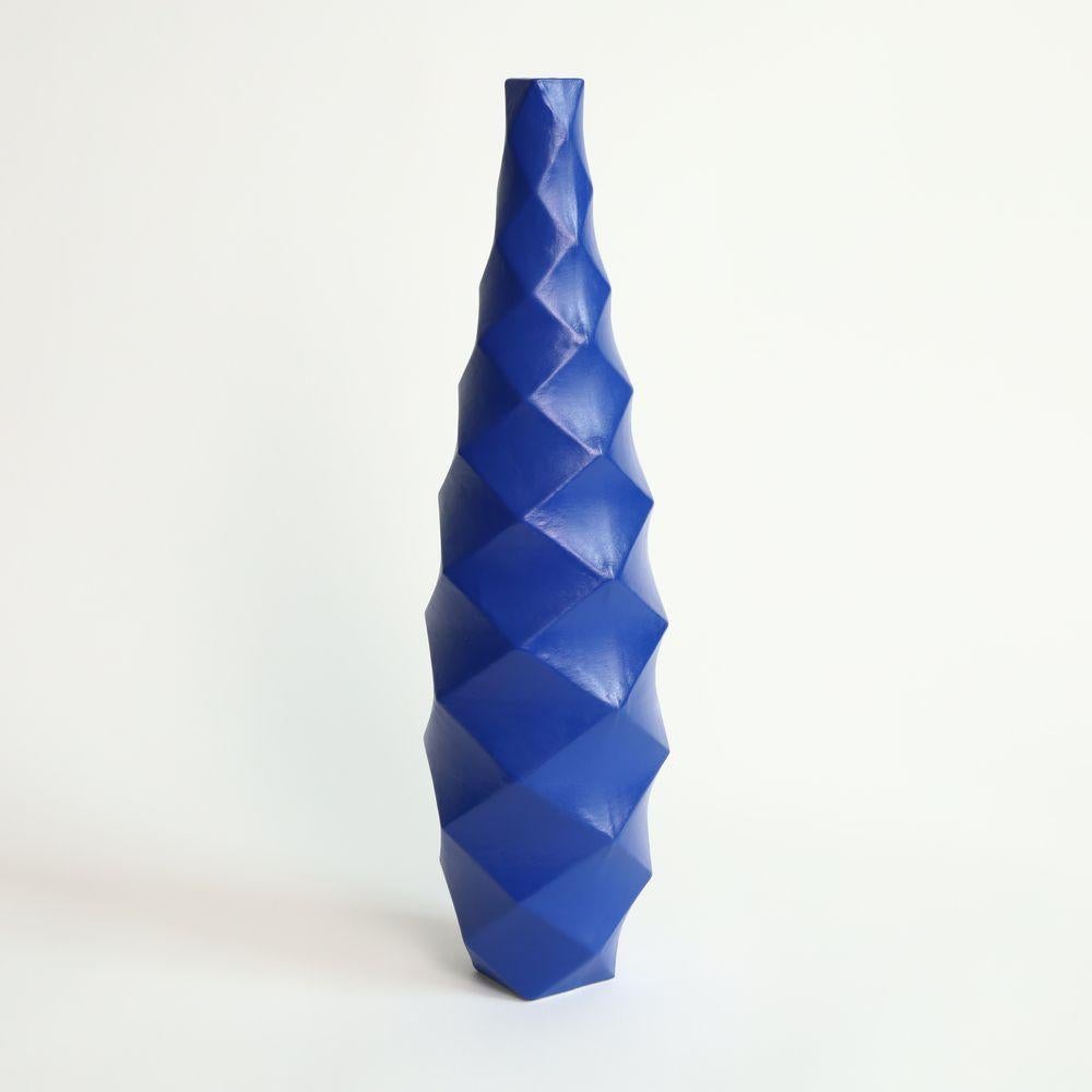 Tower in Cobalt
The Tower is a stunning piece of contemporary art that exudes an air of sophistication and elegance. Its towering form, which rises up to an impressive height, commands attention and inspires awe.
One of the most striking features of