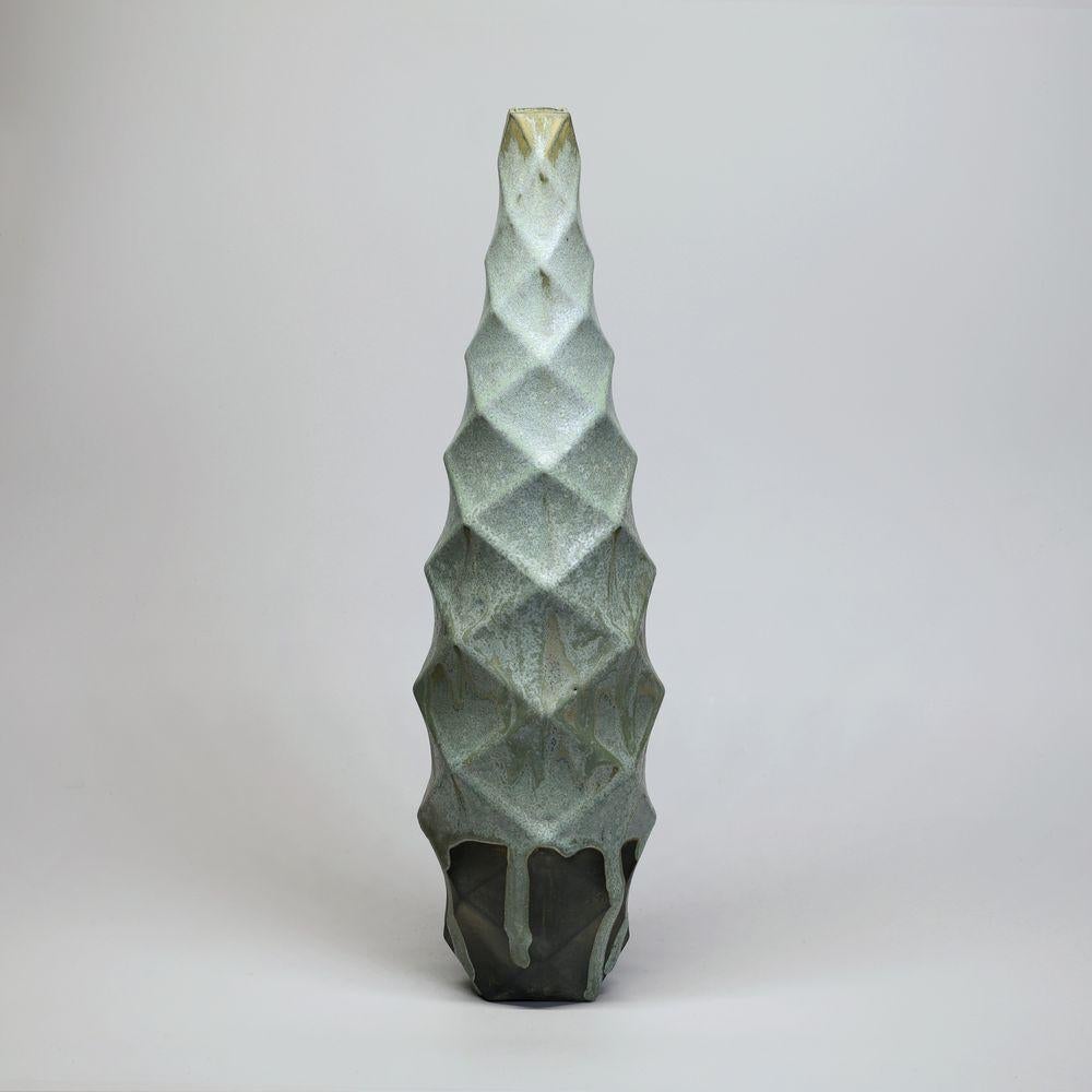 Tower in Lime Moondust
The Tower is a stunning piece of contemporary art that exudes an air of sophistication and elegance. Its towering form, which rises up to an impressive height, commands attention and inspires awe.
One of the most striking