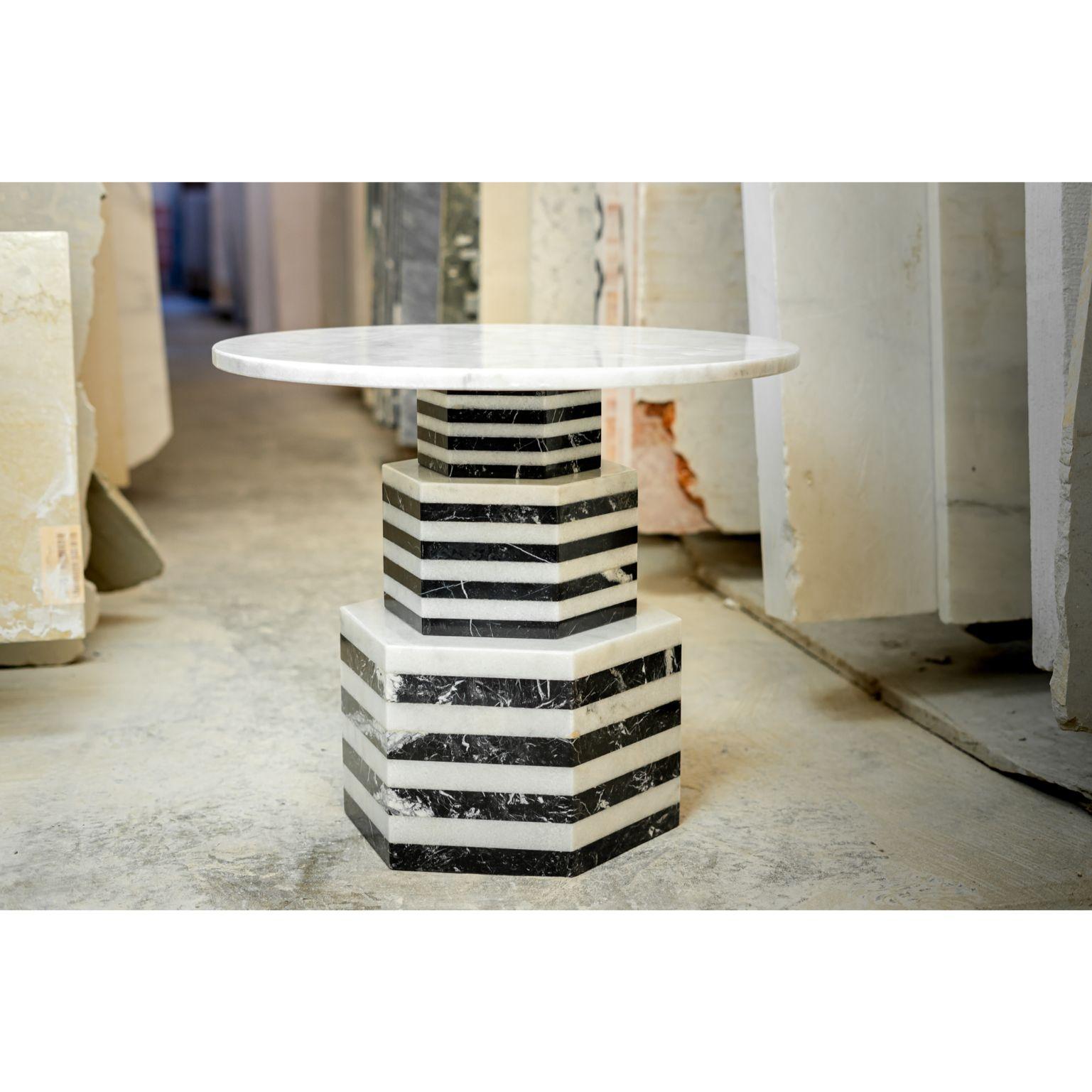 Tower Marble by Essenzia
Materials: Nero marquina, Indian white
Dimensions: 61 x 61 x 50 cm

Also Available: Rosa Portugal,

To evoke the skyscrapers of his home base, Manhattan, Javier Gomez designed Tower Marble side table using and eclectic style