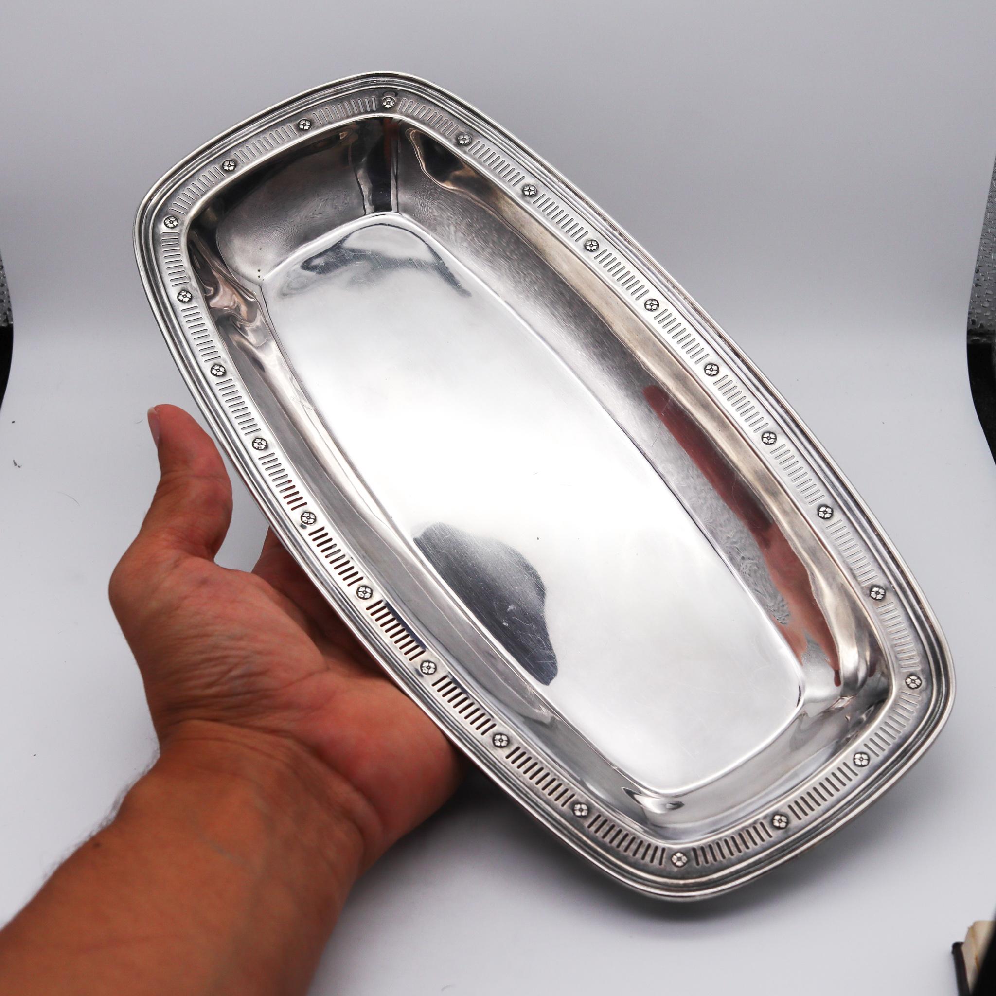 An art deco bread tray designed by Towle & Co.

Beautiful piece, created in the United States by the silversmiths makers Towle & Company, during the art deco back in the 1930. This rectangular cushion shaped bread tray was nicely crafted with