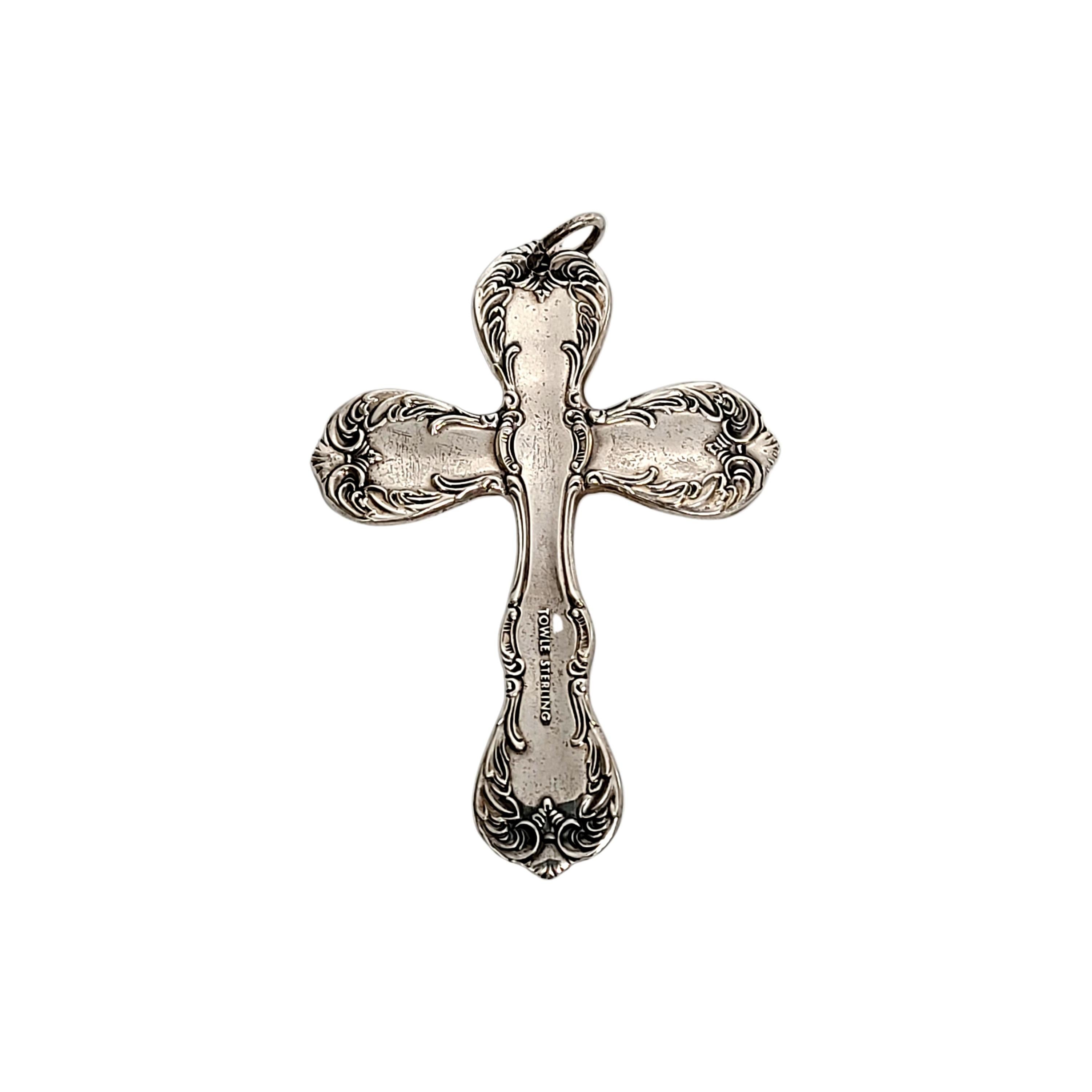 Sterling silver cross in Towle's Old Master flatware pattern.

Cross features the design from the ends of handles in Towle's Old Master pattern, with a small floral accent at the center. Can be used as a pendant or an ornament,

Measures 2 1/2
