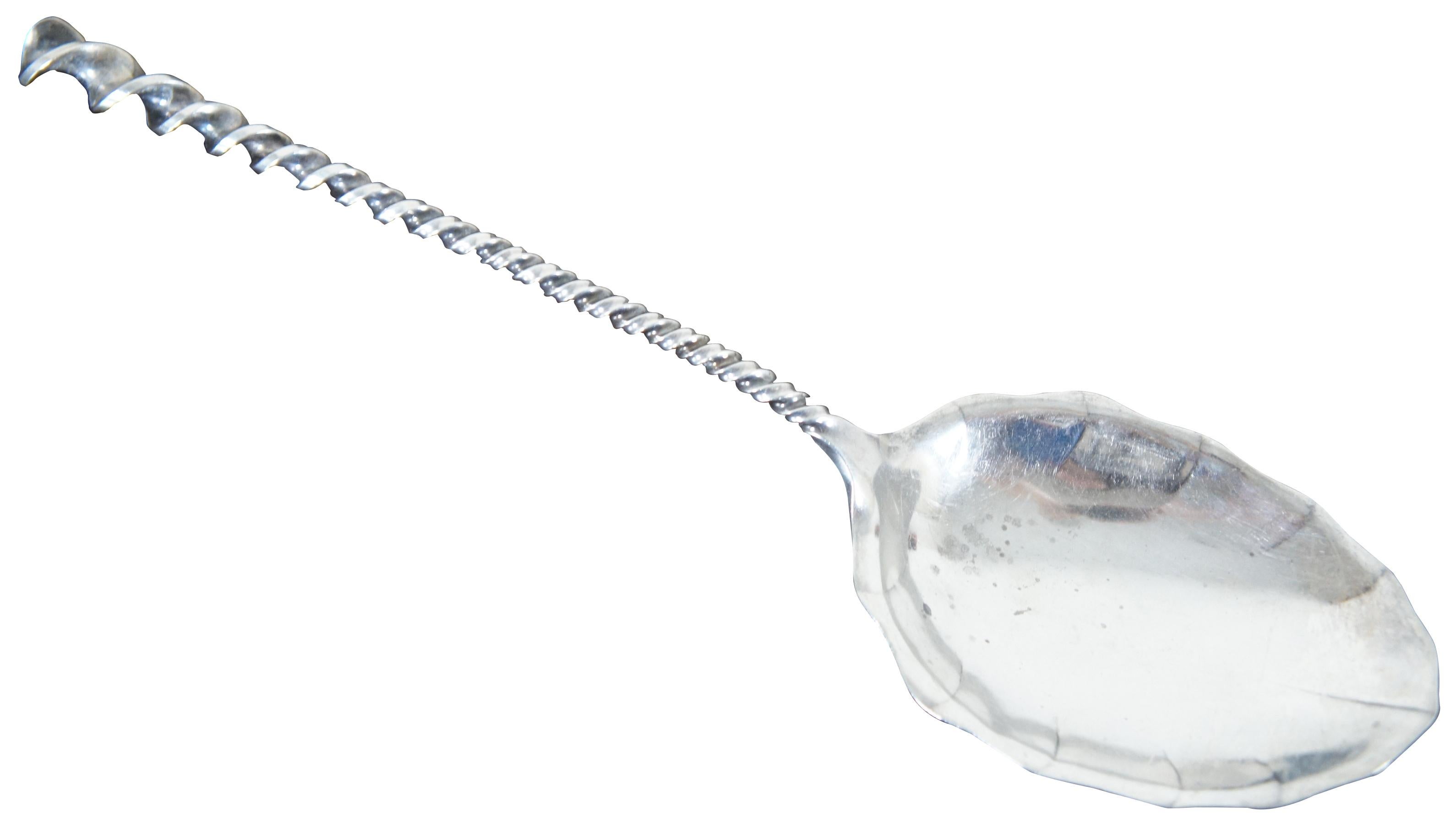 Antique sterling silver 925 serving spoon with twisted handle and lightly scalloped bowl, engraved on the back with the name “Bennett.” Sterling 128. Measures: 10