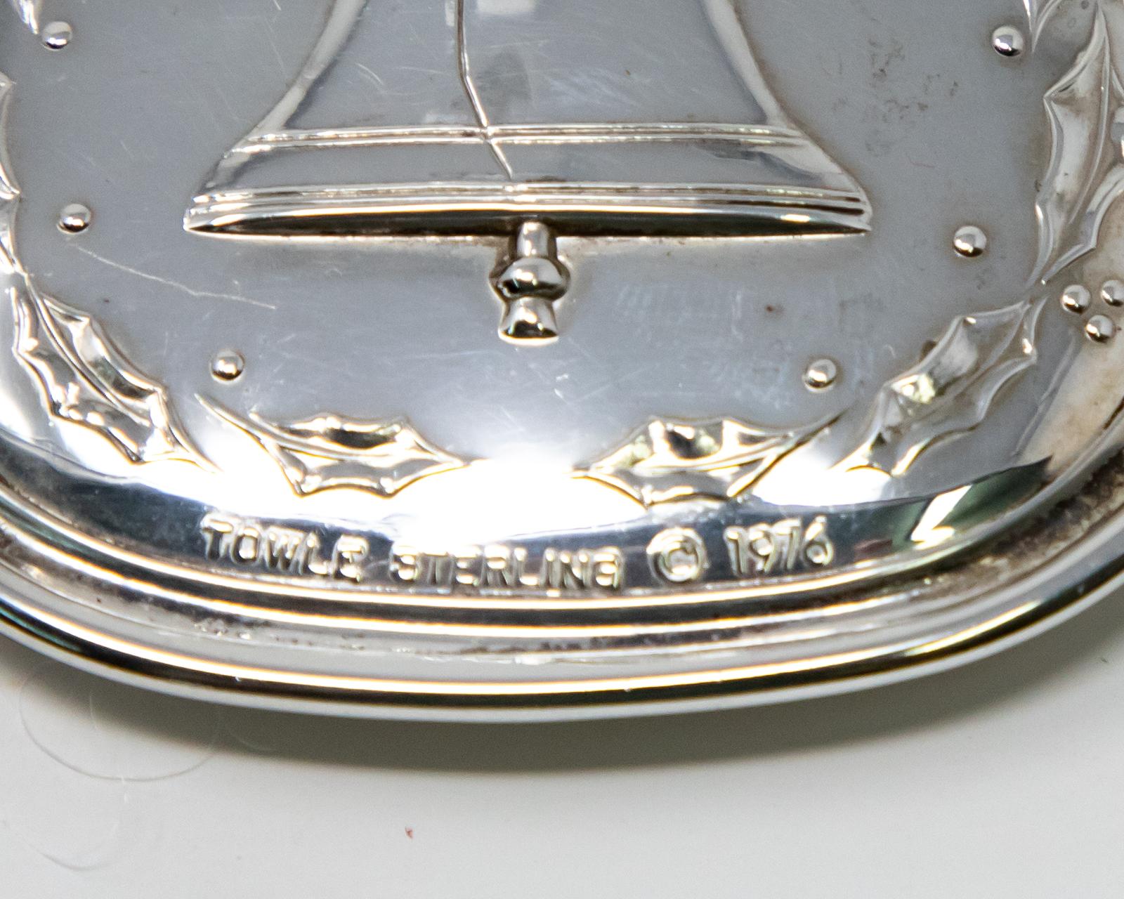 Offering this beautiful Towle sterling ornament from 1976. The front depicts the six geese a laying with scrollwork. The back depicts the Liberty Bell and is marked Towle Sterling, 1976.