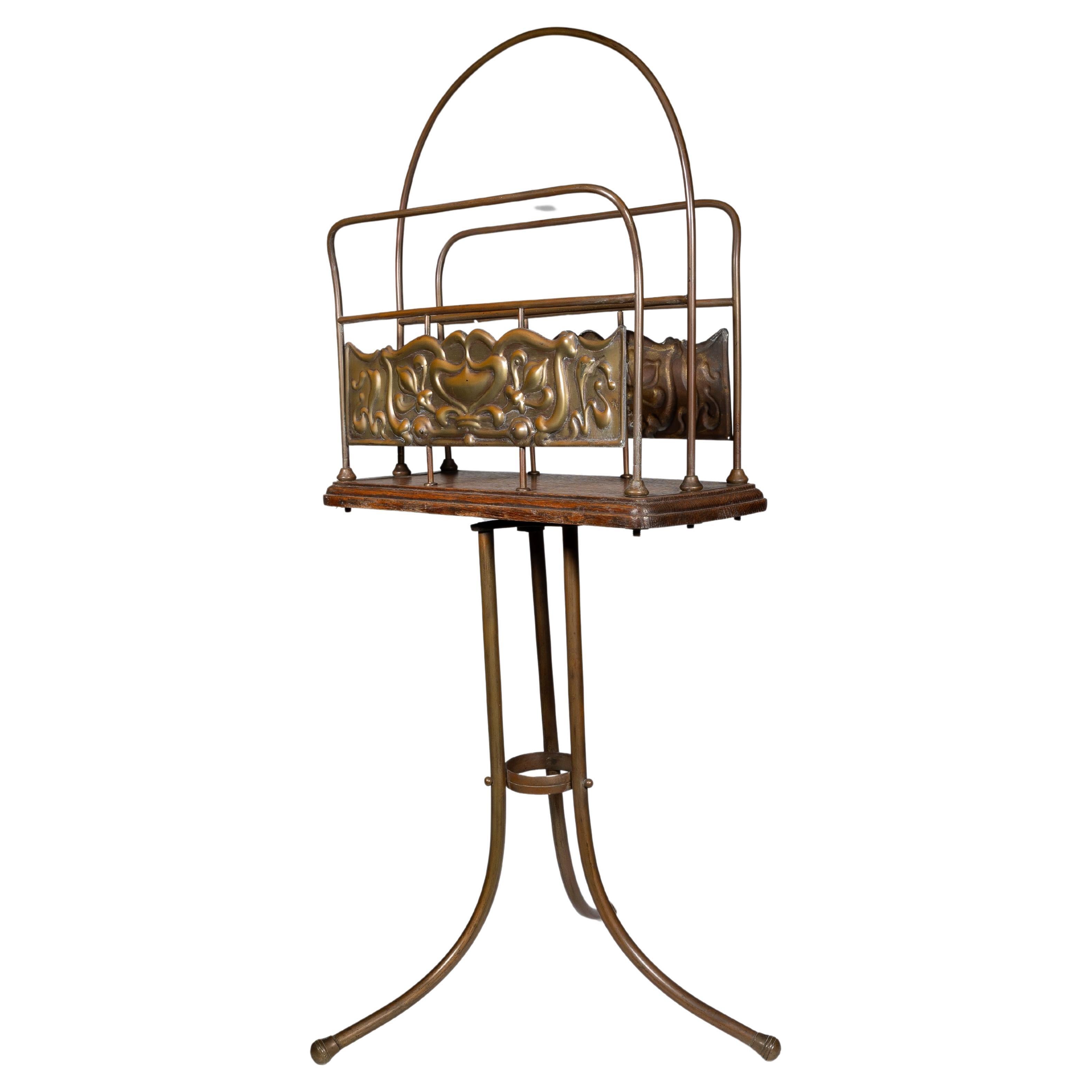 Townshends Brassfounders. An Arts & Crafts revolving tripod magazine rack