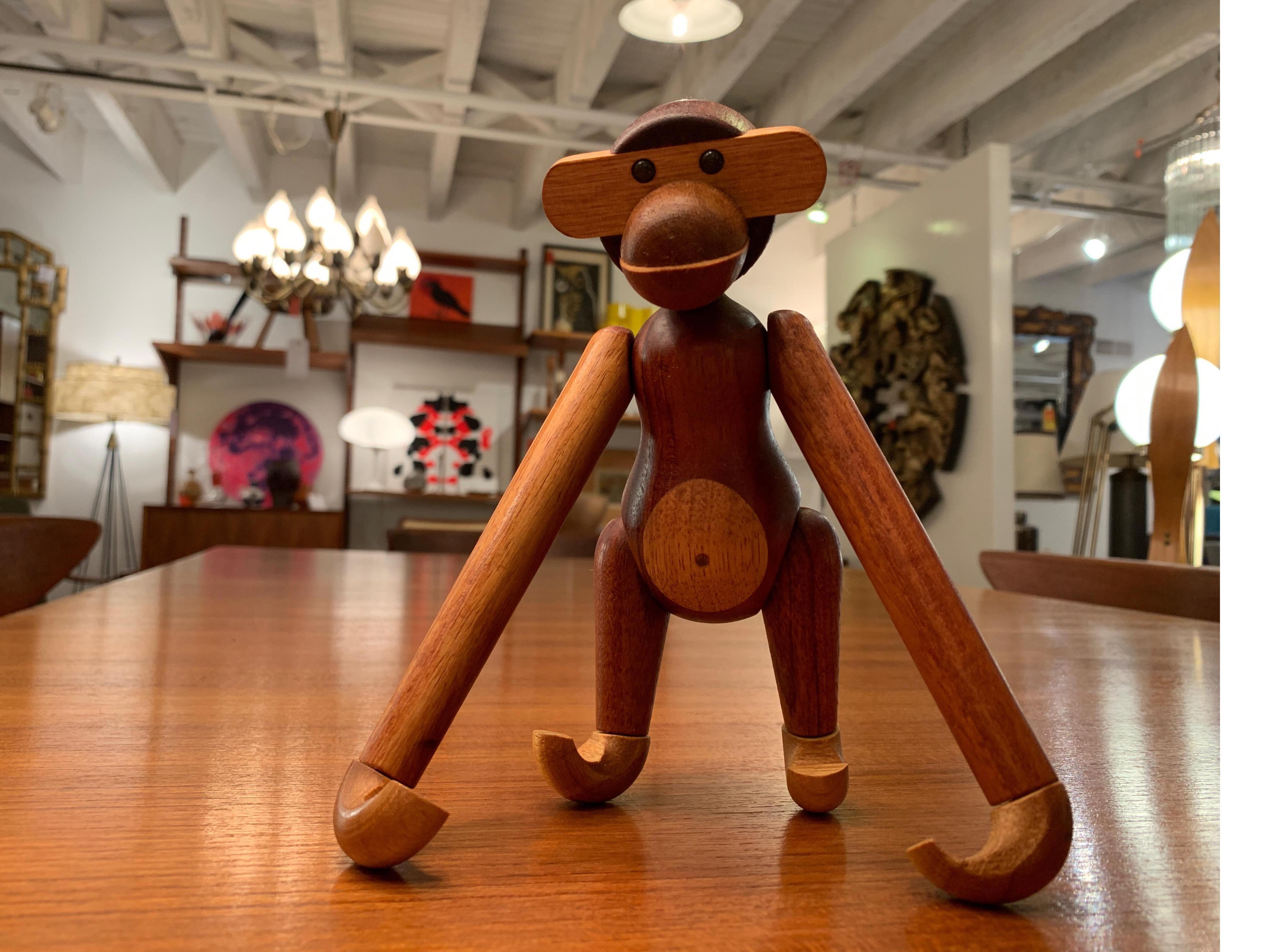 Charming and beautiful articulated monkey in teak and limba wood by Kay Bojesen, Denmark, 1960s. A wonderful accessory sure to accentuate your decor.