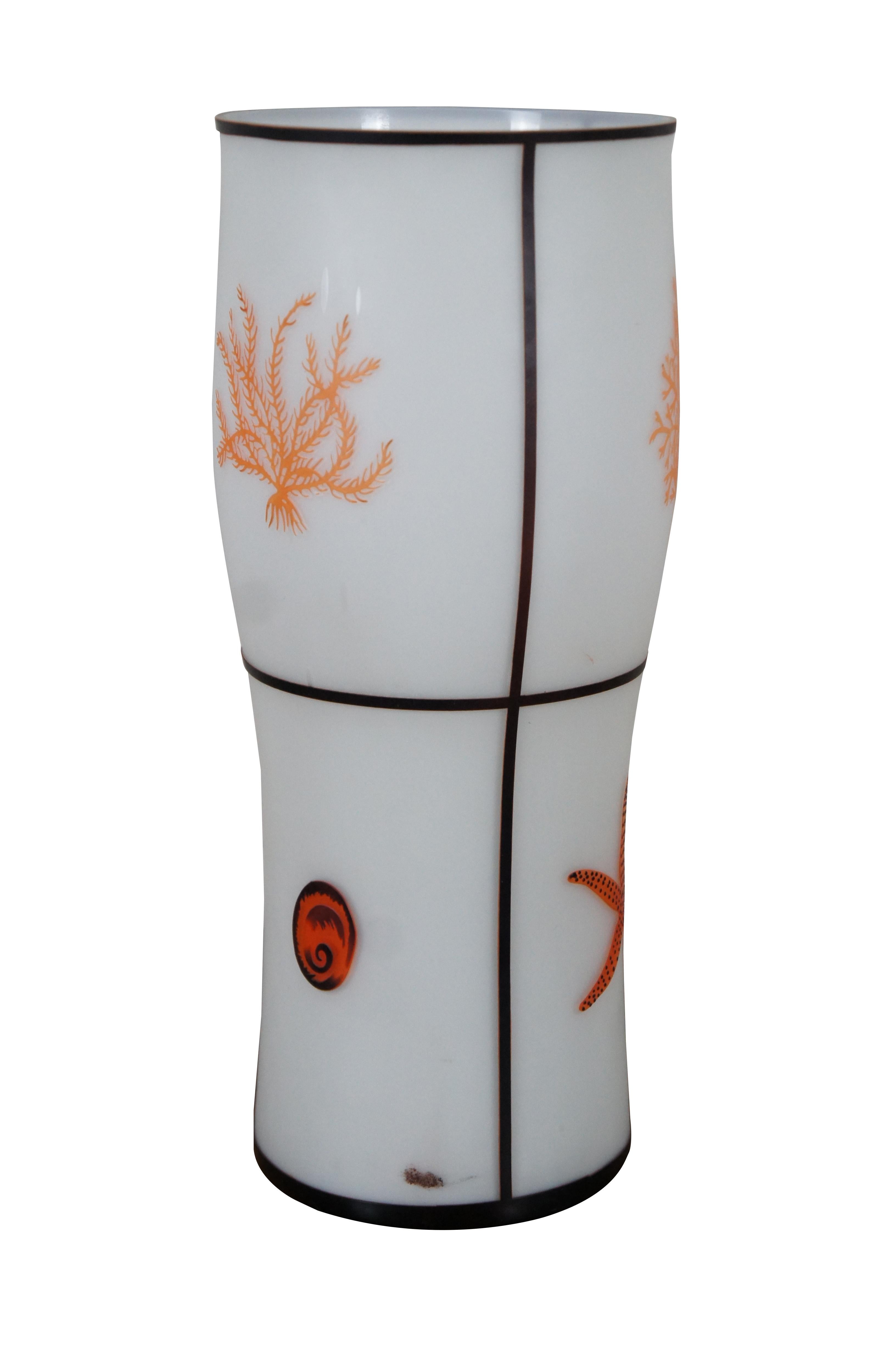 Tozai Home white frosted glass tapered canister shaped table lamp featuring segmented sections blazoned with orange sea creatures and coral. volumes terracotta pitcher. Measure: 18