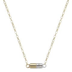 9ct yellow gold, silver and diamond 'Diet Pill' necklace
