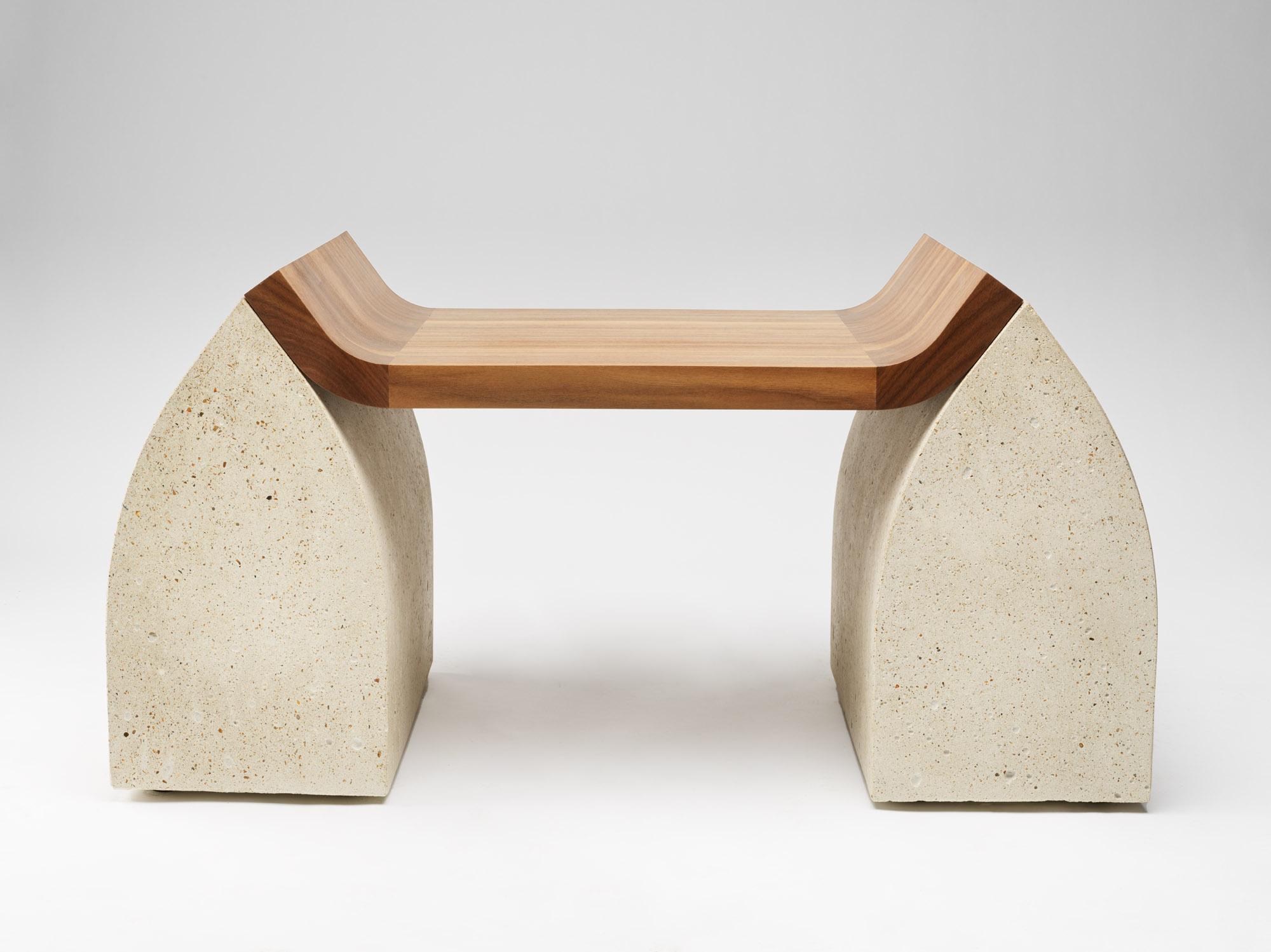 Traaf Bench by Tim Vranken
Materials: colored oak (oiled), granite
Dimensions: 105 x 60 x H 46 cm 
Variations available.  

Tim Vranken is a Belgian furniture designer who focuses on solid, handmade furniture. Throughout his designs the use of