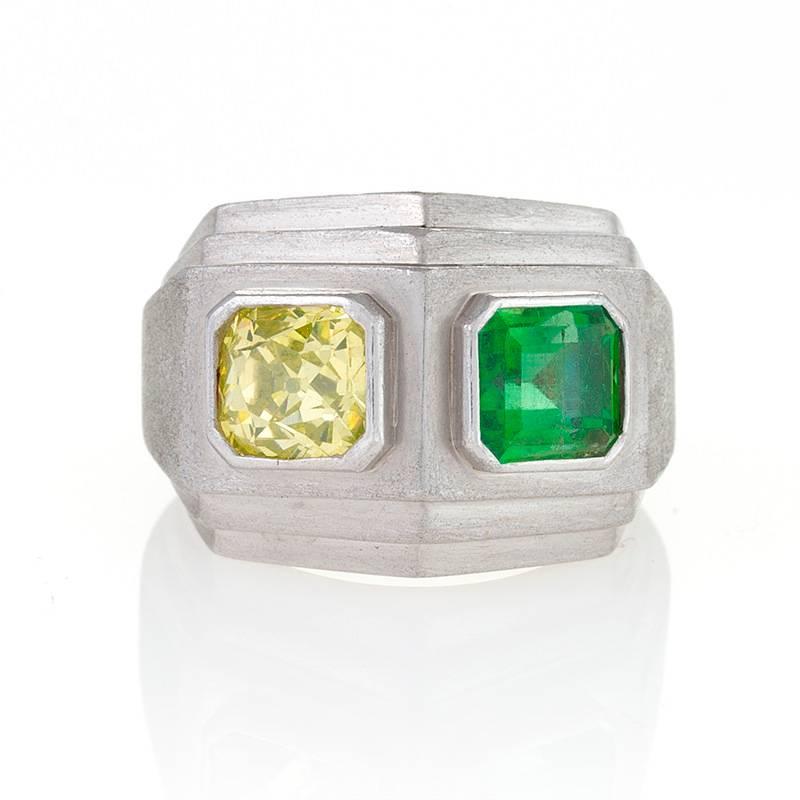 An American Art Deco diamond, emerald and platinum ring by Trabert & Hoeffer Mauboussin. This ring has a yellow cushion-cut diamond with an approximate weight of 1.75 carats, and an emerald-cut emerald with an approximate weight of 1.65 carats