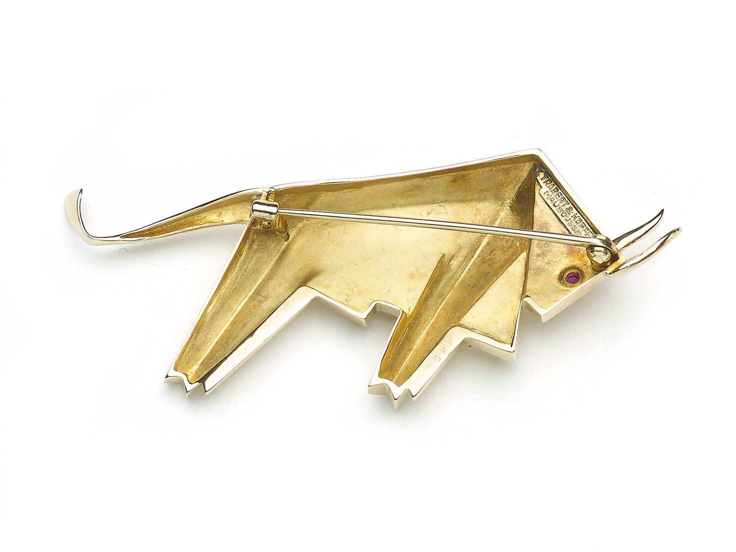 A modernist Trabert & Hoeffer – Mauboussin gold bull brooch, with a cabochon-cut ruby eye, mounted in 18ct yellow gold, circa 1945.