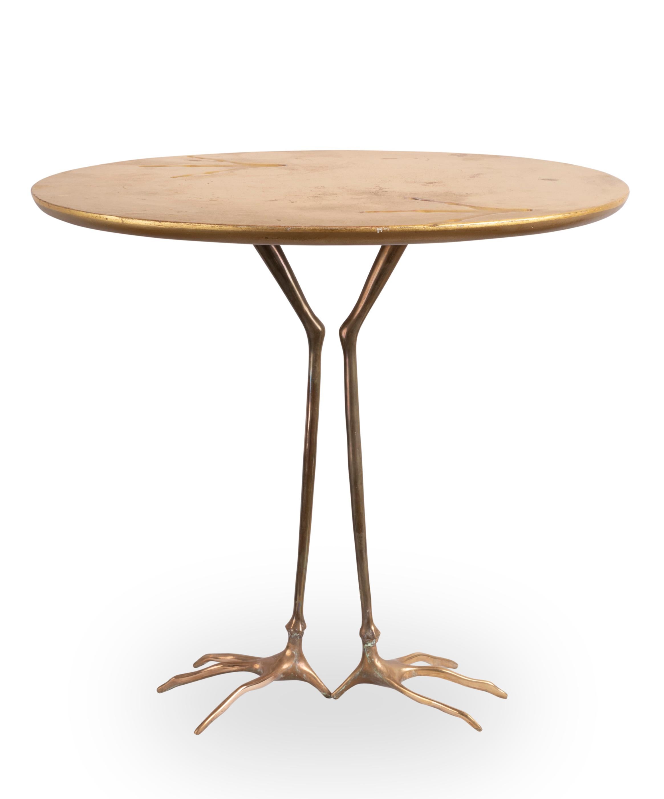 Traccia table designed by Meret Oppenheim
Bronze feet, oval gilded wood top showing birds foot prints.
Designed by Meret Oppenheim in 1939
Edited by Simon Gavina from 1971

Measures: Height 64 cm (26.2 inches)
Length 67.5 cm (26.6 inches)