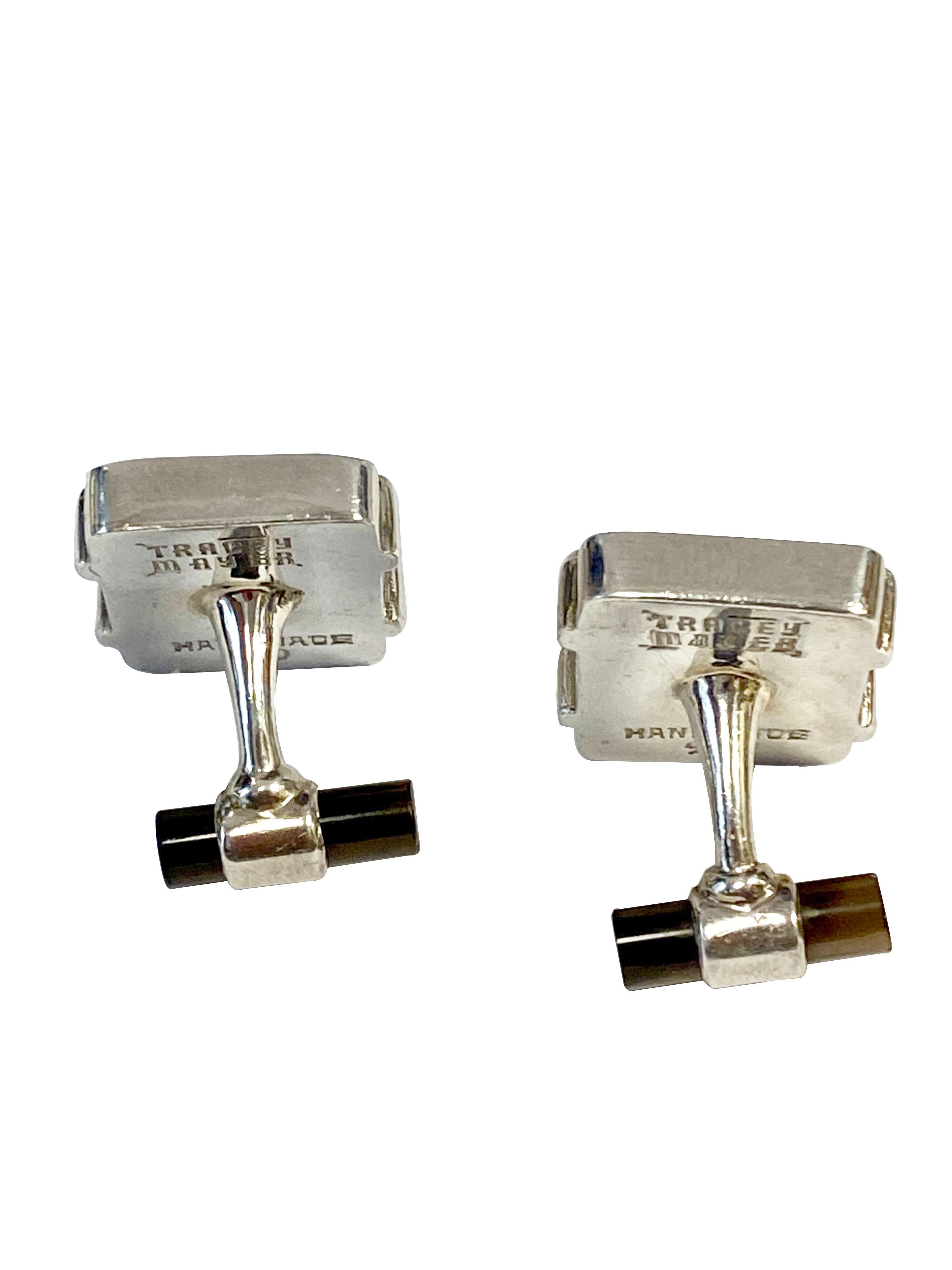 Circa 2018 Sterling Silver Cufflinks by Designer Tracey Mayer,  having a carved Bone top with en engraved Chinese Good Luck Symbol, and a Smokey Quartz Topaz set in the toggle portion. The tops measure 1 X 3/4 inch. 