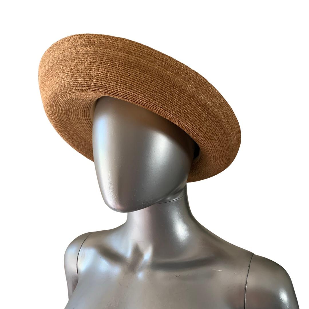 This hat is so chic! Hand made by Tracey Tooker in NYC, these hats have quite a following with Fashionistas and the rich and famous worldwide. This came from a Fashionista’s closet with quite an impressive collection. These hats are rare and can