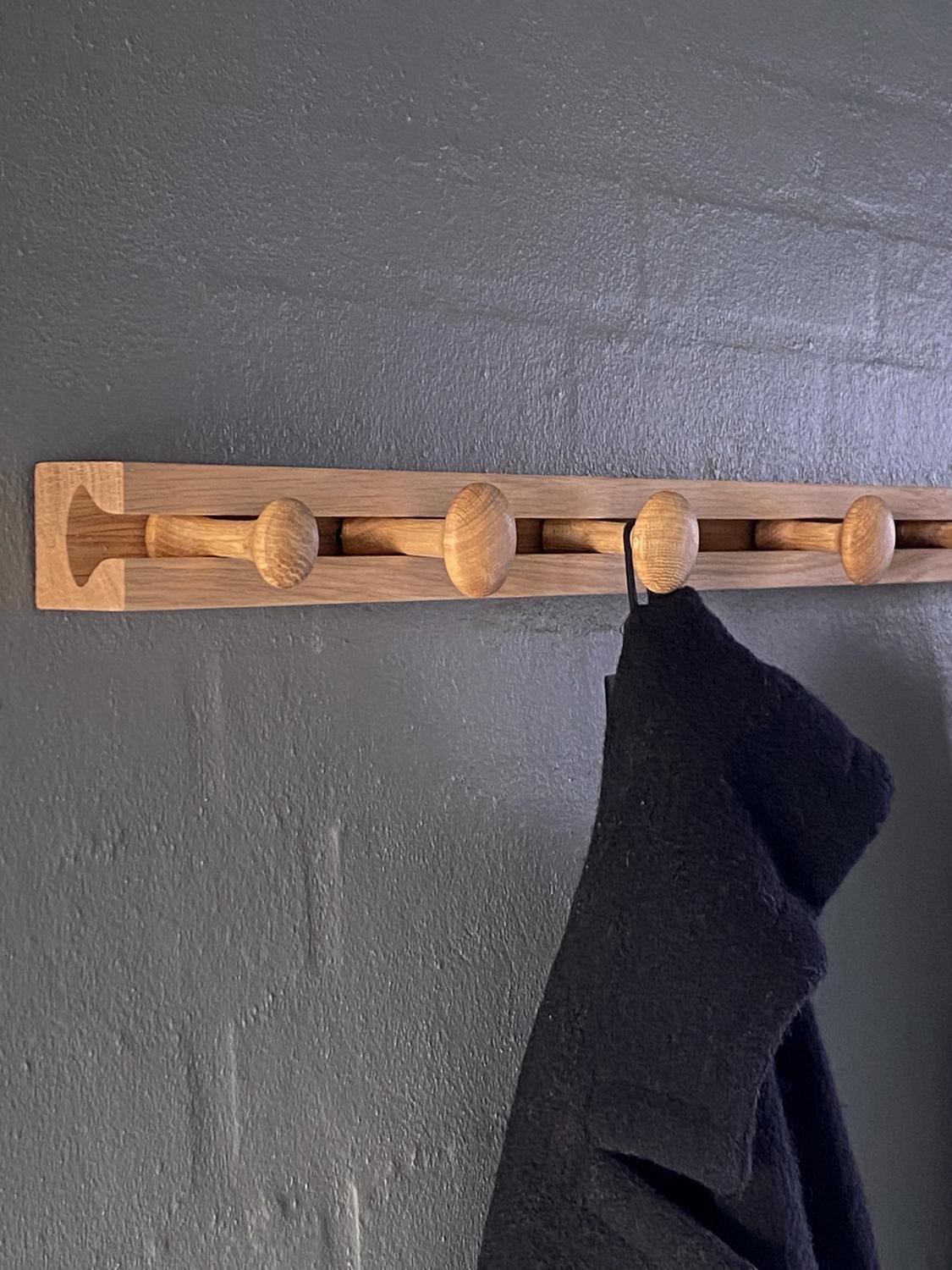 Track Coat Rack 90 by Applicata
Dimensions: D 5 x W 90 x H 3.7 cm
Materials: Oak.

Available in 60 or 90 cm.

Track is designed by Anders Nørgaard, with a fascination for the simple and intuitive. The shape is inspired by two well-known motives; a
