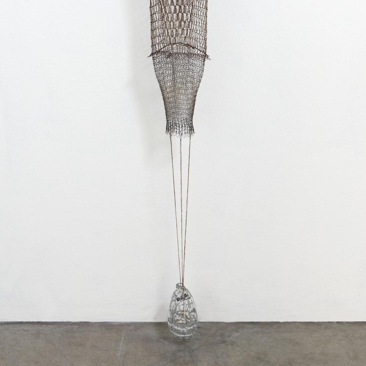 *Please message a photo of your space with wall dimensions and we will provide a photoshop rendering to scale
Medium: fabricated and crocheted metal, found object
Tracy Krumm's ongoing body of work investigates the relationships between labor,