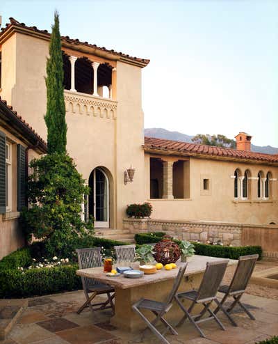  Mediterranean Family Home Exterior. Ridgetop Villa by Tucker & Marks.