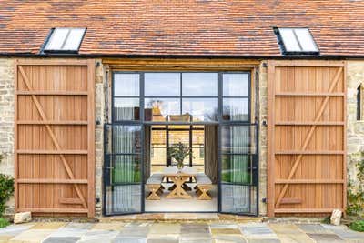  Transitional Country House Exterior. Dorset Barns by Samantha Todhunter Design Ltd..