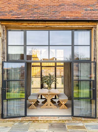  Rustic Transitional Country House Exterior. Dorset Barns by Samantha Todhunter Design Ltd..