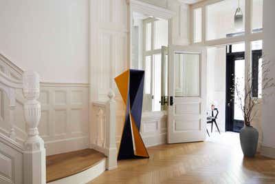 Mid-Century Modern Entry and Hall. A Townhouse for Art Obsessives by GACHOT.