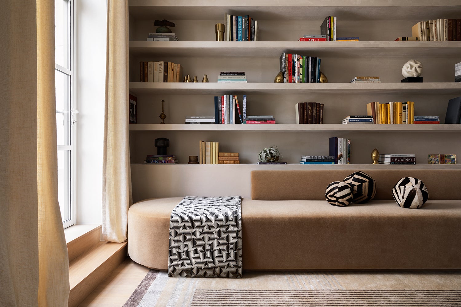 The den of a model apartment at One Wall Street in Manhattan with interiors designed by Elizabeth Graziolo of Yellow House Architects