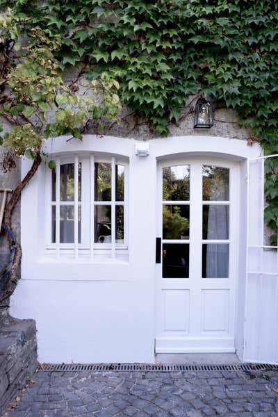  Rustic French Family Home Exterior. INTERIOR DESIGN: Basement with History by AGNES MORGUET Interior Art & Design.