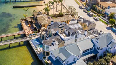  Coastal Beach House Exterior. Balboa Peninsula by Solanna Design & Development LLC.