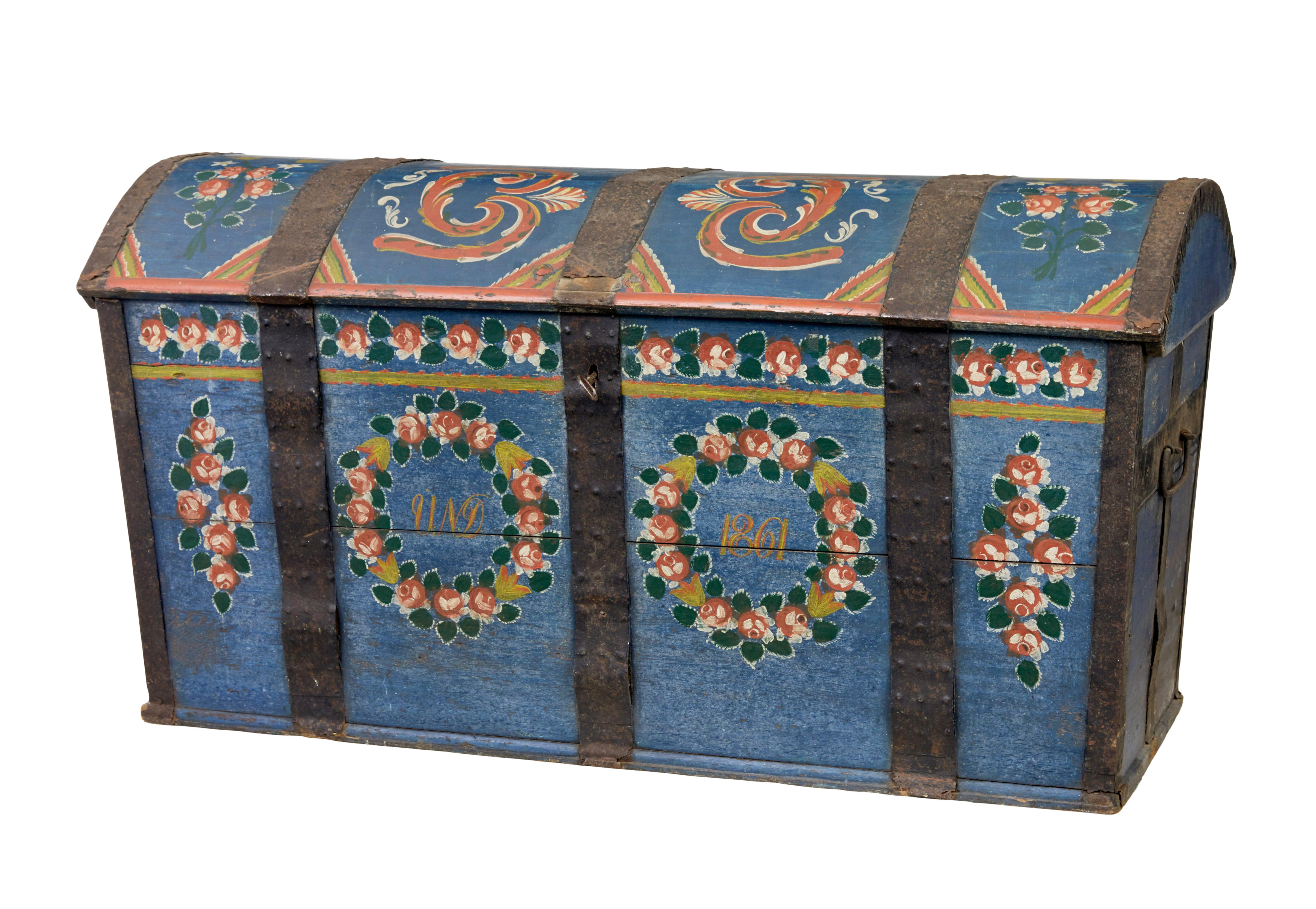Traditional 19th century painted Swedish dome trunk circa 1861.

Hand painted and dated 1861, but chest is older as they are often given away as marriage gifts.

Made from oak rather than the usual pine.  Dome top with original metal strap work