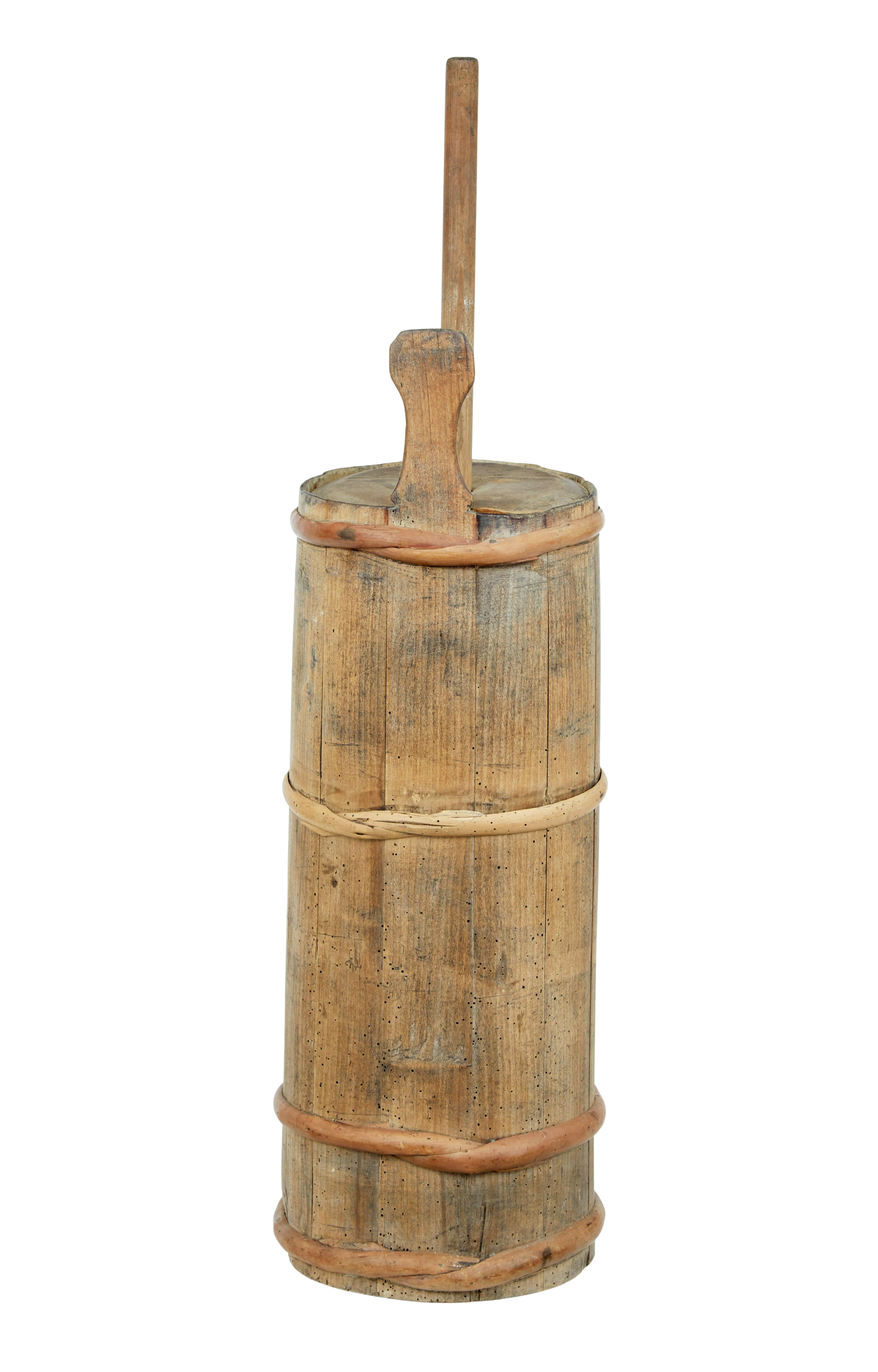 Original condition 19th century swedish butter churn circa 1870.

Rare to find complete with original lid and paddle.  Pine frame held in place by 4 cane straps.

Ideal for use as decorative piece, or for using as a stick umbrella stand.

Evidence