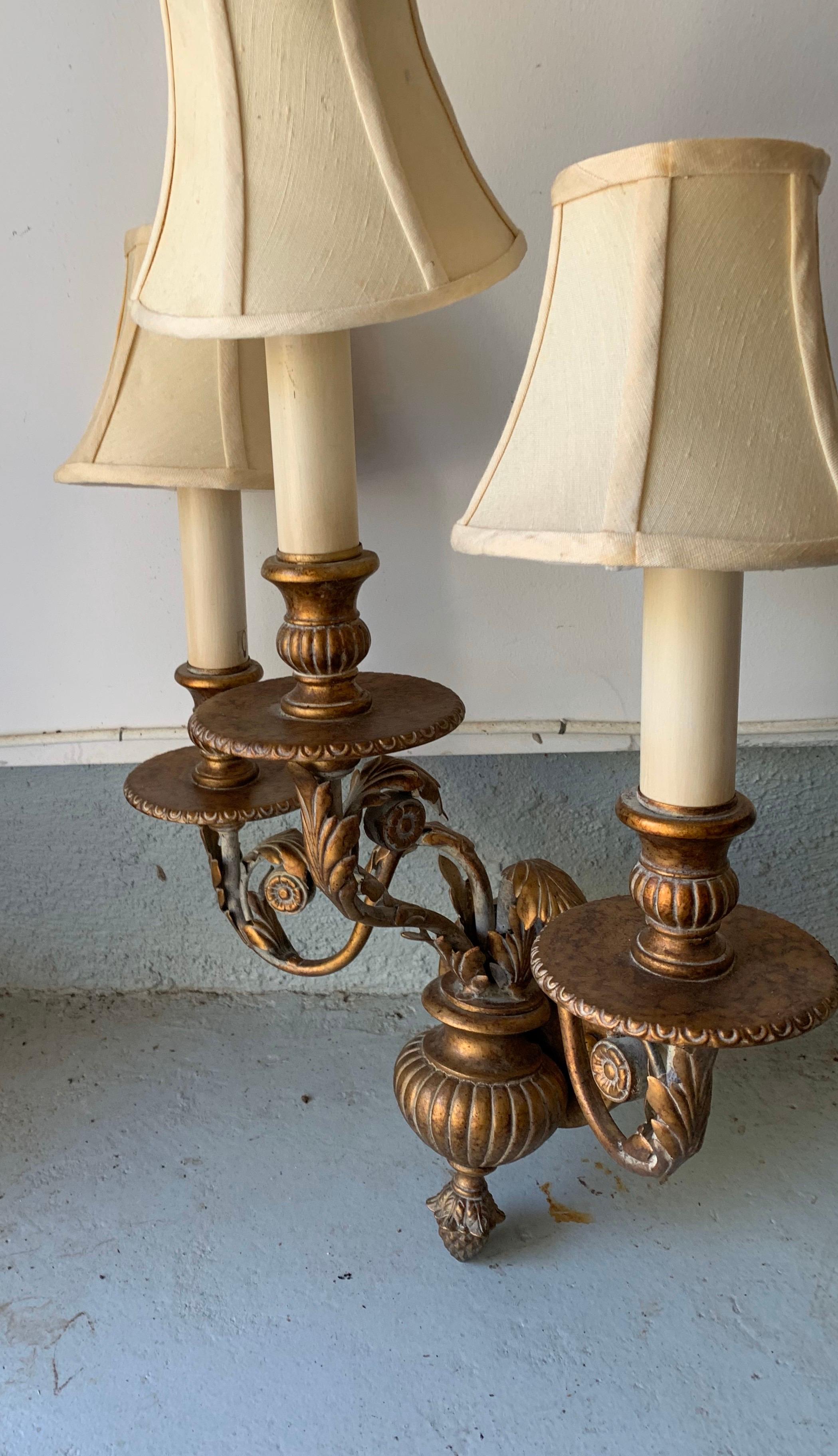 A pair of three-arm brass sconces made by the Fine Art Lamps company in Miami Lakes, FL, circa 1990.

UL listed.

Includes silk shades.

Dimnesions:
Sconces, 24 inches H x 16 inches w x 9 inches D x 5 inches wall plate
Shades, 3.25 inches