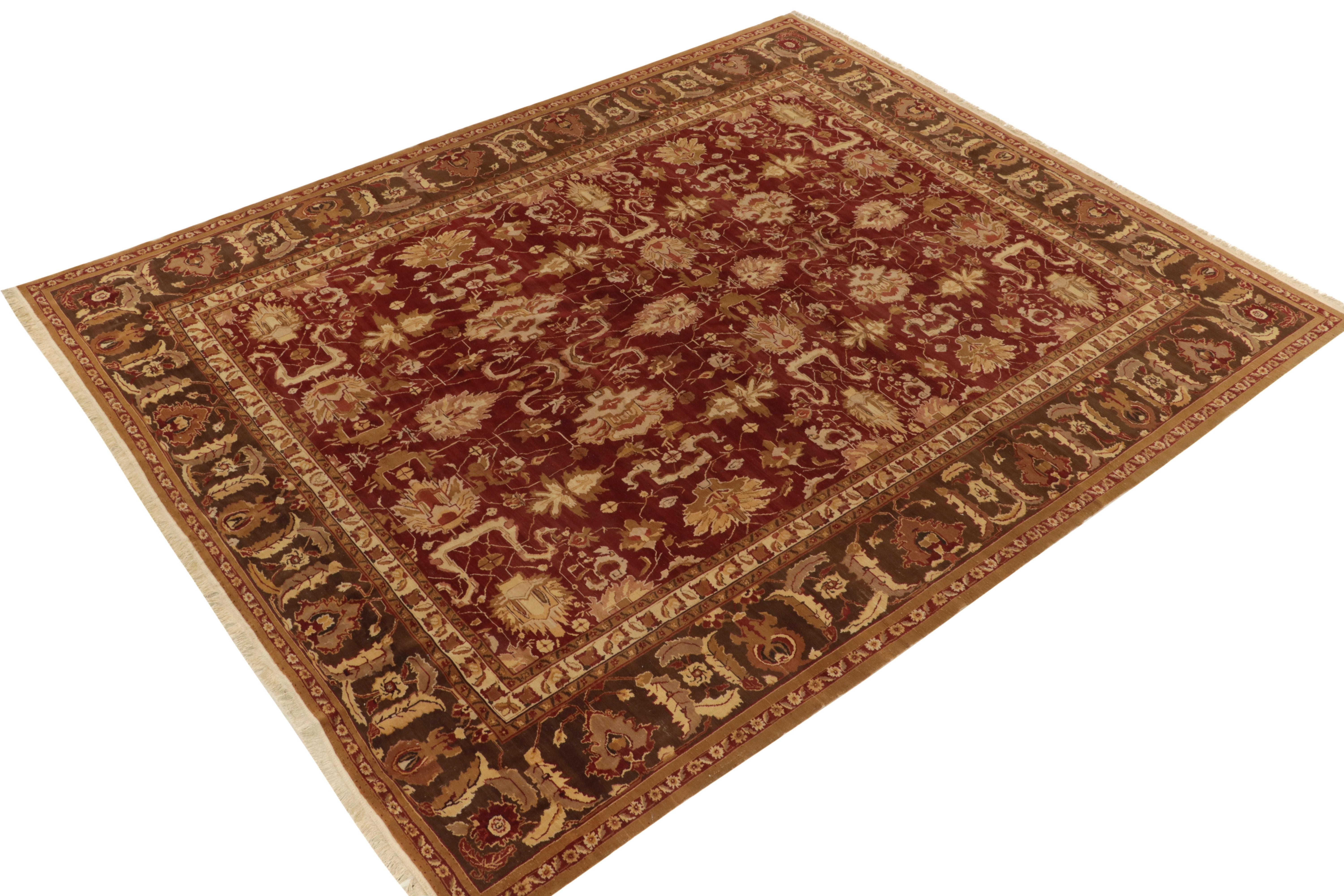 Hand-knotted in all wool, an Agra inspired floral rug relishing gorgeous striations on a 9x12 frame. The floral palmette motifs & cloudbands in rich red & brown enjoy kisses of beige & peach complementing the handsome geometry on the gracious scale.